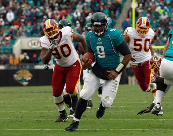 JACKSONVILLE, FL - DECEMBER 26: Quarterback David Garrard #9 of the Jacksonville Jaguars runs for a touchdaown during the game against the Washington Redskins at EverBank Field on December 26, 2010 in Jacksonville, Florida.  (Photo by Sam Greenwood/Getty 