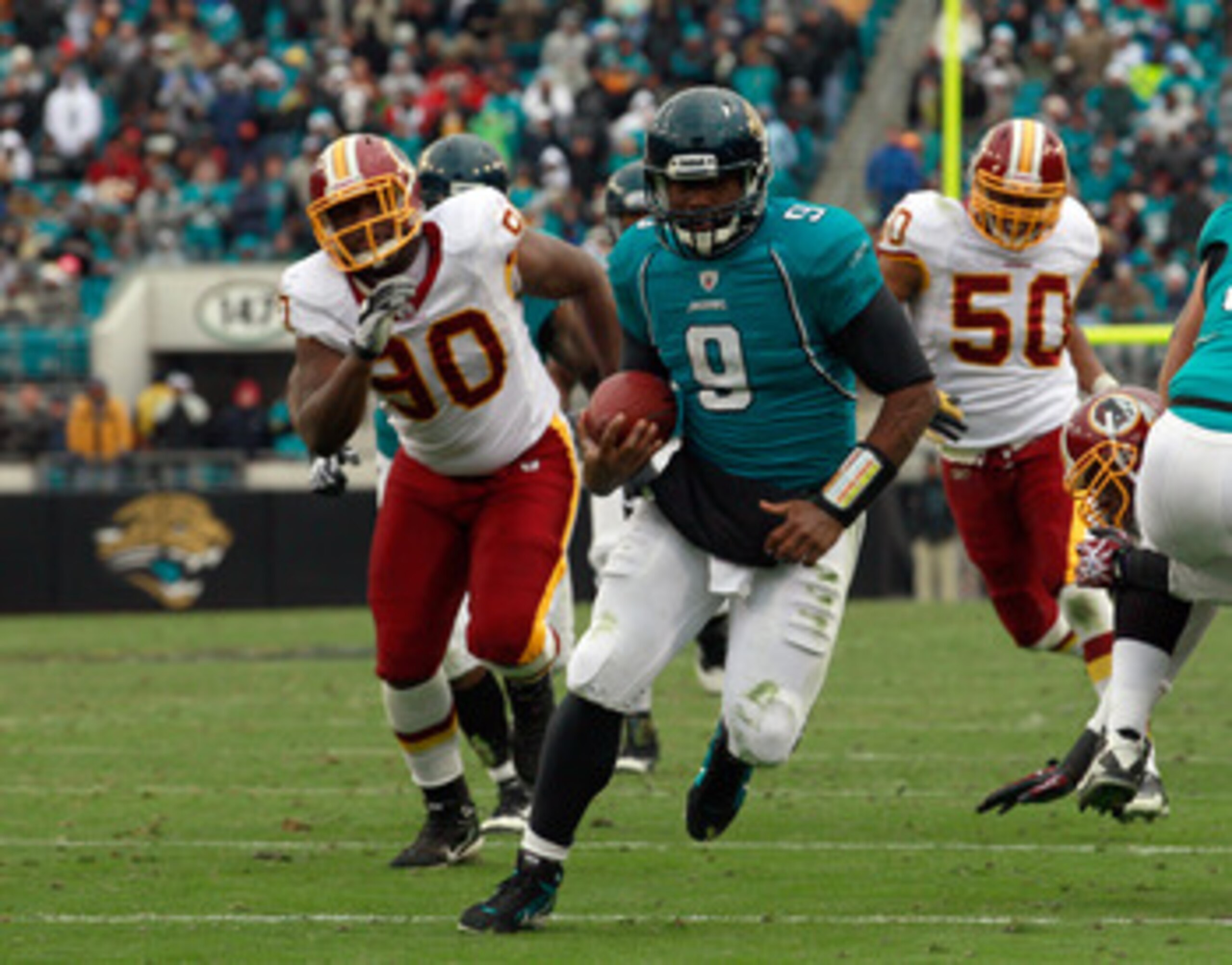 JACKSONVILLE, FL - DECEMBER 26: Quarterback David Garrard #9 of the Jacksonville Jaguars runs for a touchdaown during the game against the Washington Redskins at EverBank Field on December 26, 2010 in Jacksonville, Florida.  (Photo by Sam Greenwood/Getty 