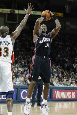 OAKLAND, CA - APRIL 8:  Karl Malone #32 of the Utah Jazz shoots over Antawn Jamison #33 of the Golden State Warriors during the game at The Arena in Oakland on April 8, 2003 in Oakland, California.  The Warriors won 128-102.  NOTE TO USER: User expressly