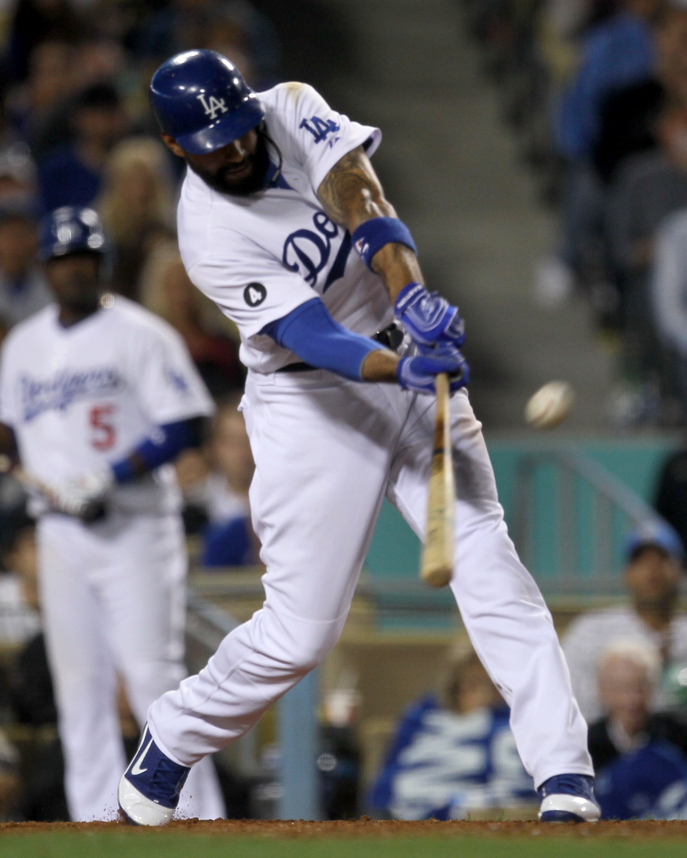 LOS ANGELES - MAY 13:  Matt Kemp #27 of the Los Angeles Dodgers hits an RBI double in the sixth inning against the Arizona Diamondbacks on May 13, 2011 at Dodger Stadium in Los Angeles, California.  (Photo by Stephen Dunn/Getty Images)