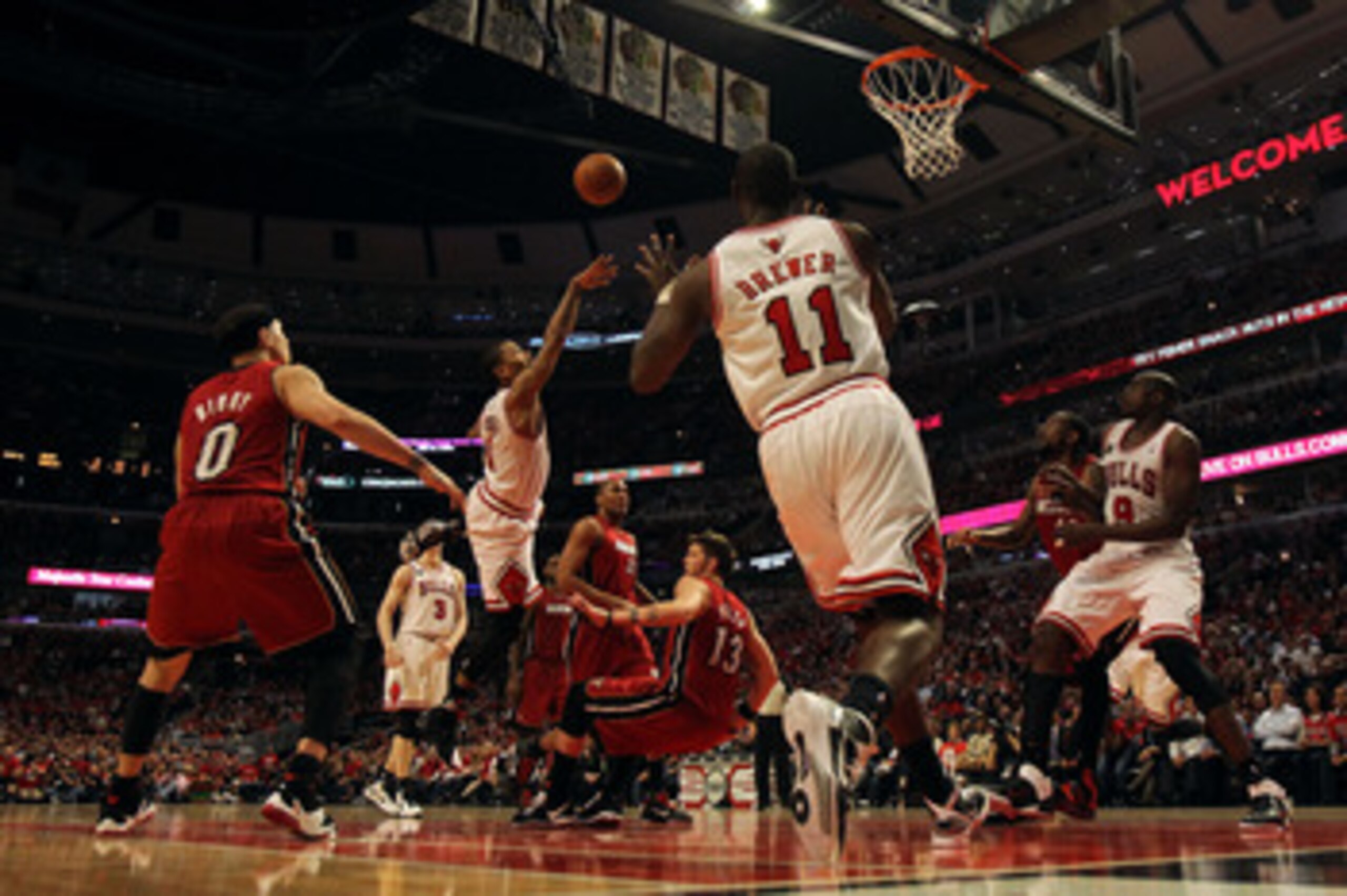 CHICAGO, IL - MAY 18:  Derrick Rose #1 of the Chicago Bulls drives for a shot attempt against Mike Miller #13 of the Miami Heat in Game Two of the Eastern Conference Finals during the 2011 NBA Playoffs on May 18, 2011 at the United Center in Chicago, Illi