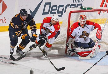 BUFFALO, NY - MARCH 25: Tomas Vokoun #29 and Jason Garrison #52 of the Florida Panthers defend against Drew Stafford #21 of the Buffalo Sabres at HSBC Arena on March 25, 2011 in Buffalo, New York.  (Photo by Rick Stewart/Getty Images)