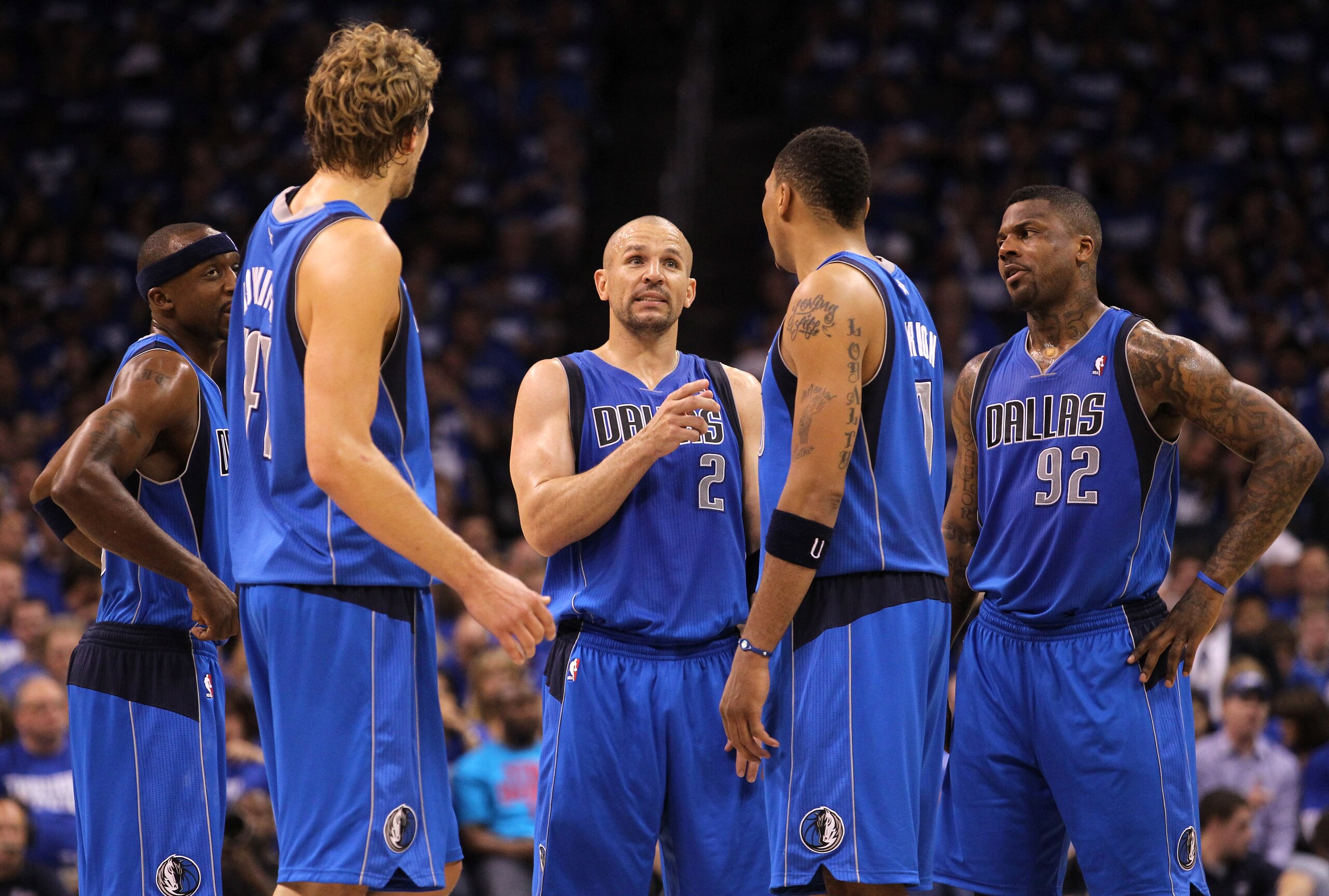 OKLAHOMA CITY, OK - MAY 21:  (C) Jason Kidd #2 of the Dallas Mavericks talks with teammates Jason Terry #31, Dirk Nowitzki #41, Shawn Marion #0 and DeShawn Stevenson #92 while taking on the Oklahoma City Thunder in Game Three of the Western Conference Fin