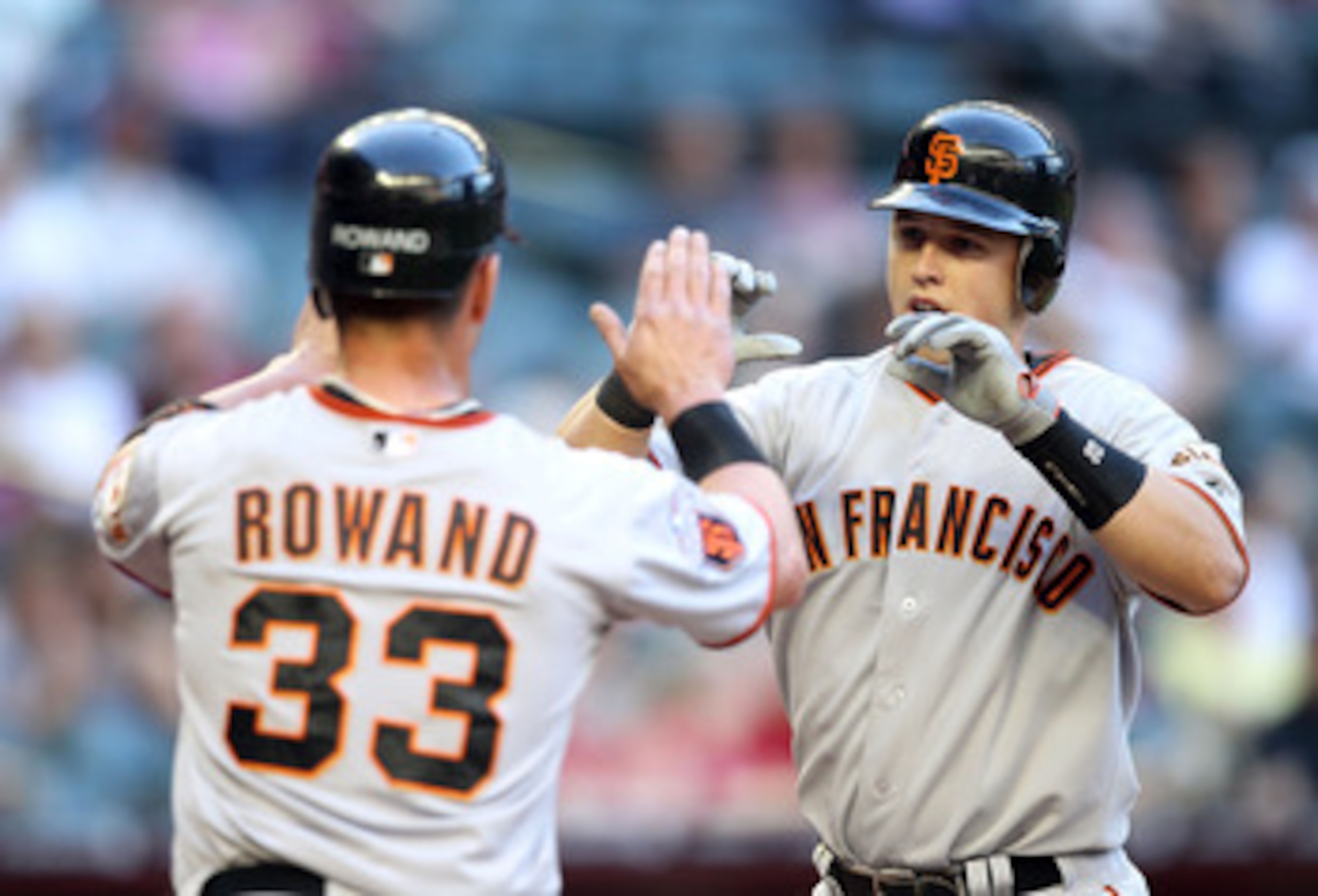 PHOENIX, AZ - APRIL 16: Buster Posey #28 of the San Francisco Giants high fives teammate Aaron Rowand #33 after Posey hit a two run home run against the Arizona Diamondbacks during the first inning of the Major League Baseball game at Chase Field on Apri PHOENIX, AZ - APRIL 16: Buster Posey #28 of the San Francisco Giants high fives teammate Aaron Rowand #33 after Posey hit a two run home run against the Arizona Diamondbacks during the first inning of the Major League Baseball game at Chase Field on Apri