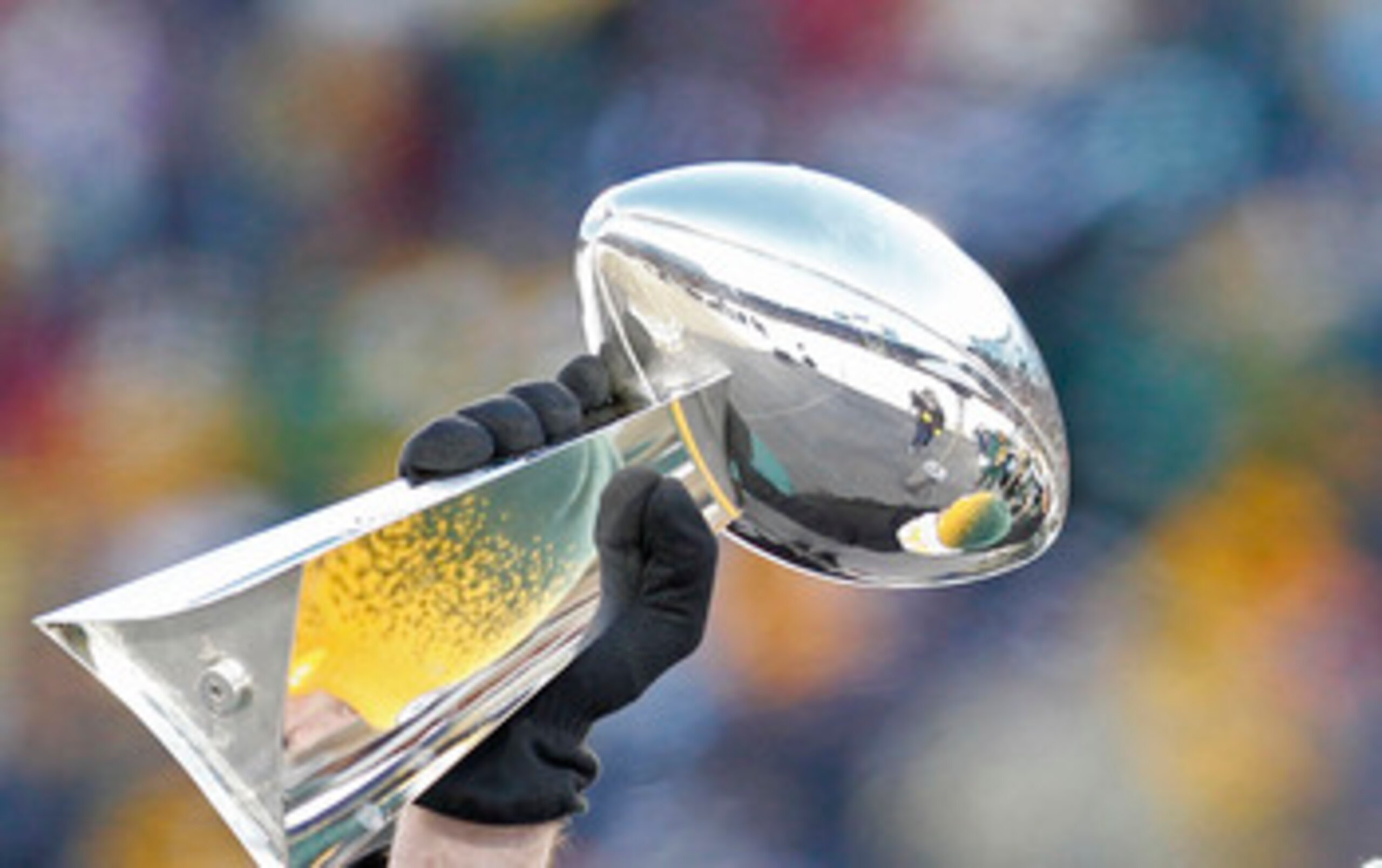 GREEN BAY, WI - FEBRUARY 08:  Green Bay Packers quarterback Aaron Rodgers hoists the Lombardi Trophy during the Packers victory ceremony at Lambeau Field on February 8, 2011 in Green Bay, Wisconsin.  (Photo by Matt Ludtke/Getty Images)