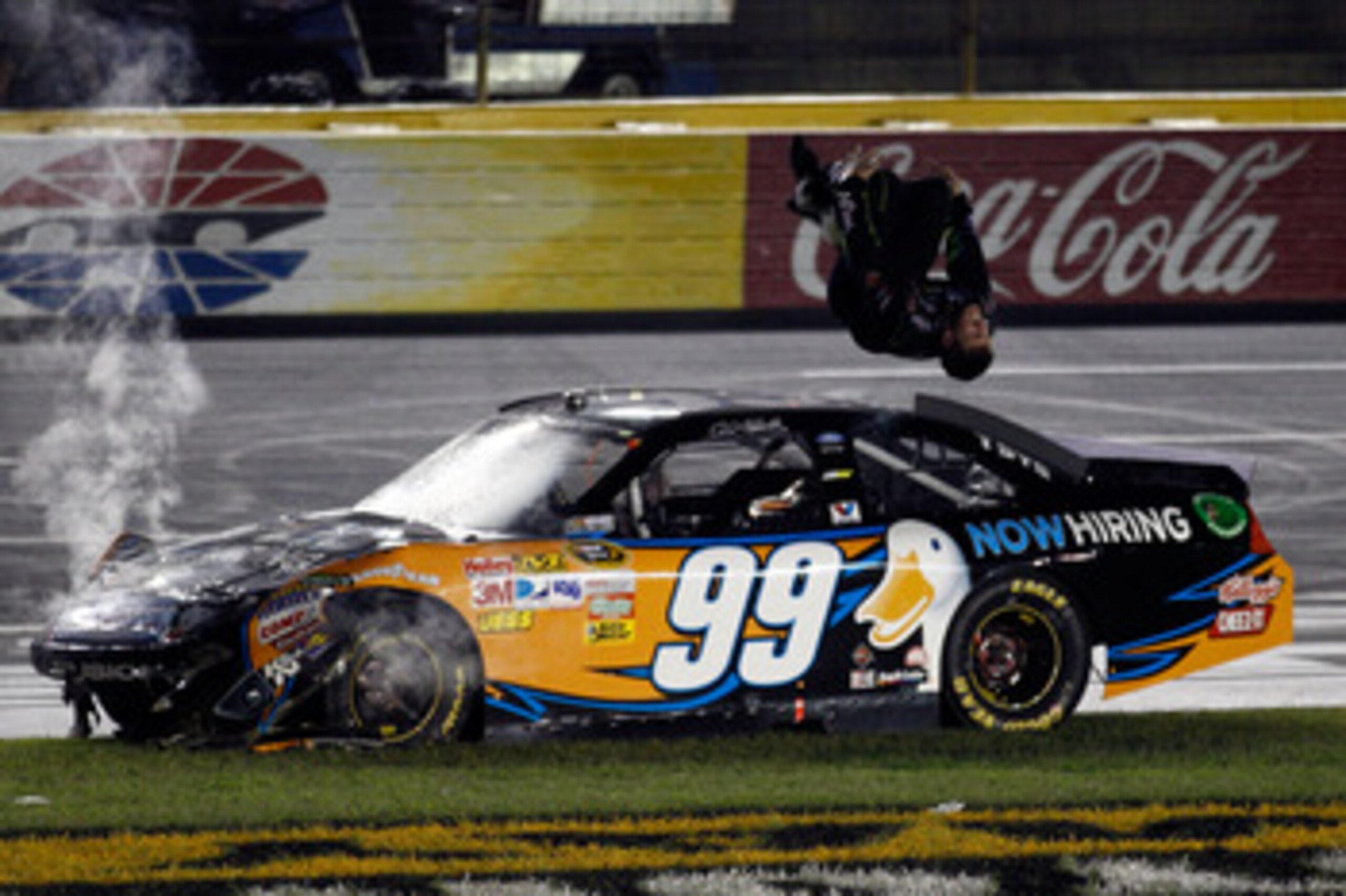 CHARLOTTE, NC - MAY 21:  Carl Edwards, driver of the #99 Aflac Ford, does a backflip in celebration after winning the NASCAR Sprint All-Star Race at Charlotte Motor Speedway on May 21, 2011 in Charlotte, North Carolina.  (Photo by Chris Graythen/Getty Ima