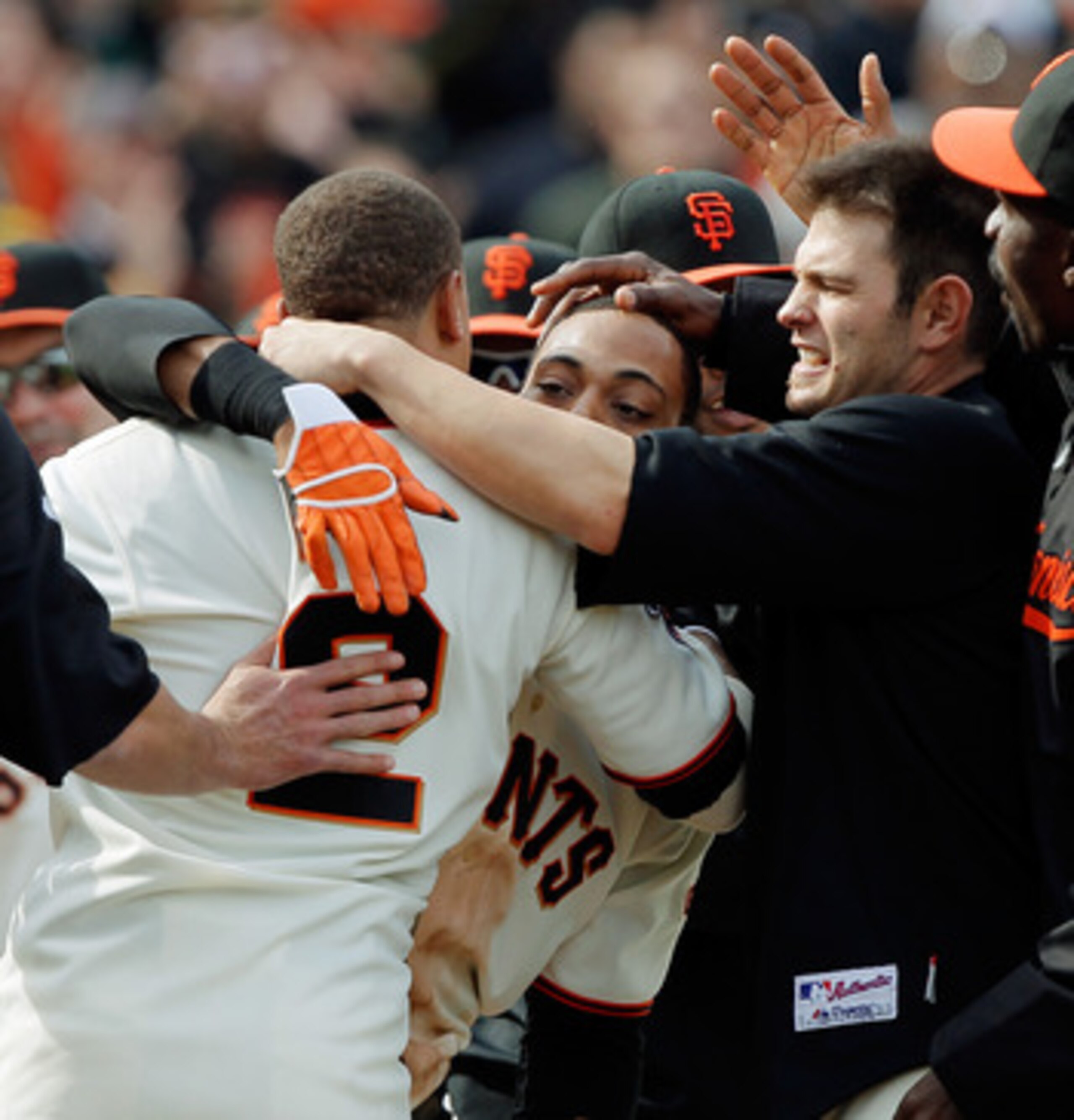 SAN FRANCISCO, CA - MAY 22: Darren Ford #34 of the San Francisco Giants gets mobbed after scoring the winning run on a single by Emmanuel Burriss #2 against the Oakland A's in the 11th inning at AT&T Park on May 22, 2011 in San Francisco, California. The SAN FRANCISCO, CA - MAY 22: Darren Ford #34 of the San Francisco Giants gets mobbed after scoring the winning run on a single by Emmanuel Burriss #2 against the Oakland A's in the 11th inning at AT&T Park on May 22, 2011 in San Francisco, California. The
