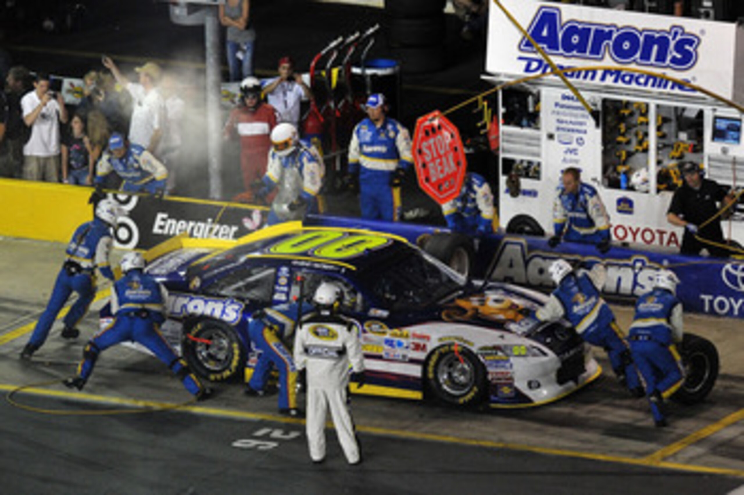 CHARLOTTE, NC - MAY 21:  David Reutimann, driver of the #00 Aaron's Dream Machine Toyota, makes a pit stop during the NASCAR Sprint All-Star Race at Charlotte Motor Speedway on May 21, 2011 in Charlotte, North Carolina.  (Photo by Drew Hallowell/Getty Ima