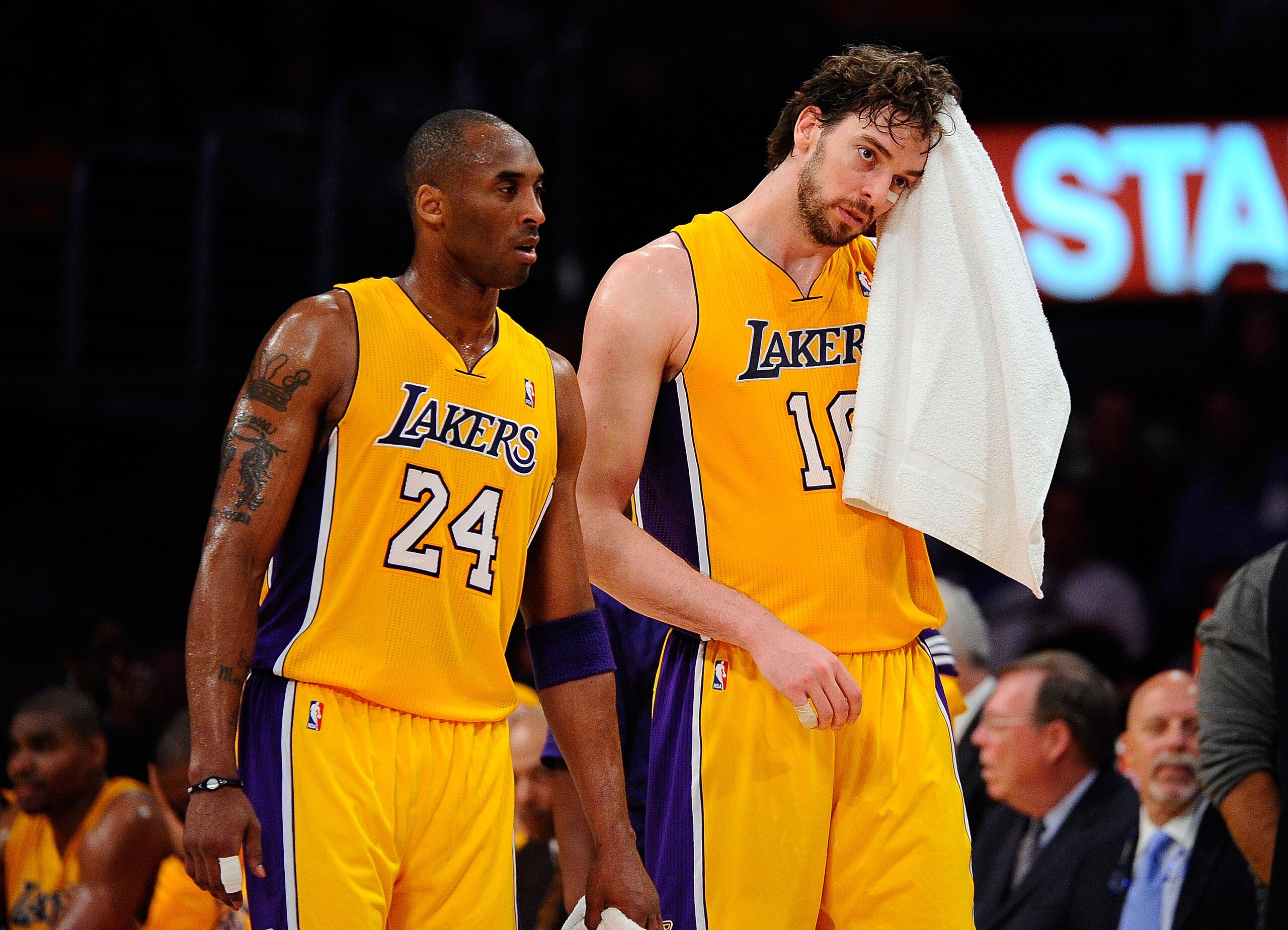 LOS ANGELES, CA - APRIL 20:  Kobe Bryant #24 and Pau Gasol #16 of the Los Angeles Lakers walk from the sideline while taking on the New Orleans Hornets in Game Two of the Western Conference Quarterfinals in the 2011 NBA Playoffs on April 20, 2011 at Stapl