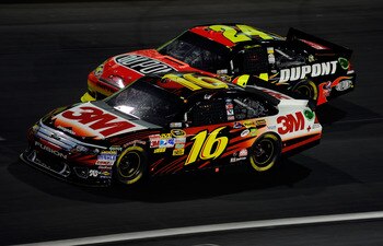 CHARLOTTE, NC - MAY 21:  Greg Biffle, driver of the #16 3M Ford, races Jeff Gordon, driver of the #24 DuPont Chevrolet, during the NASCAR Sprint All-Star Race at Charlotte Motor Speedway on May 21, 2011 in Charlotte, North Carolina.  (Photo by John Harrel