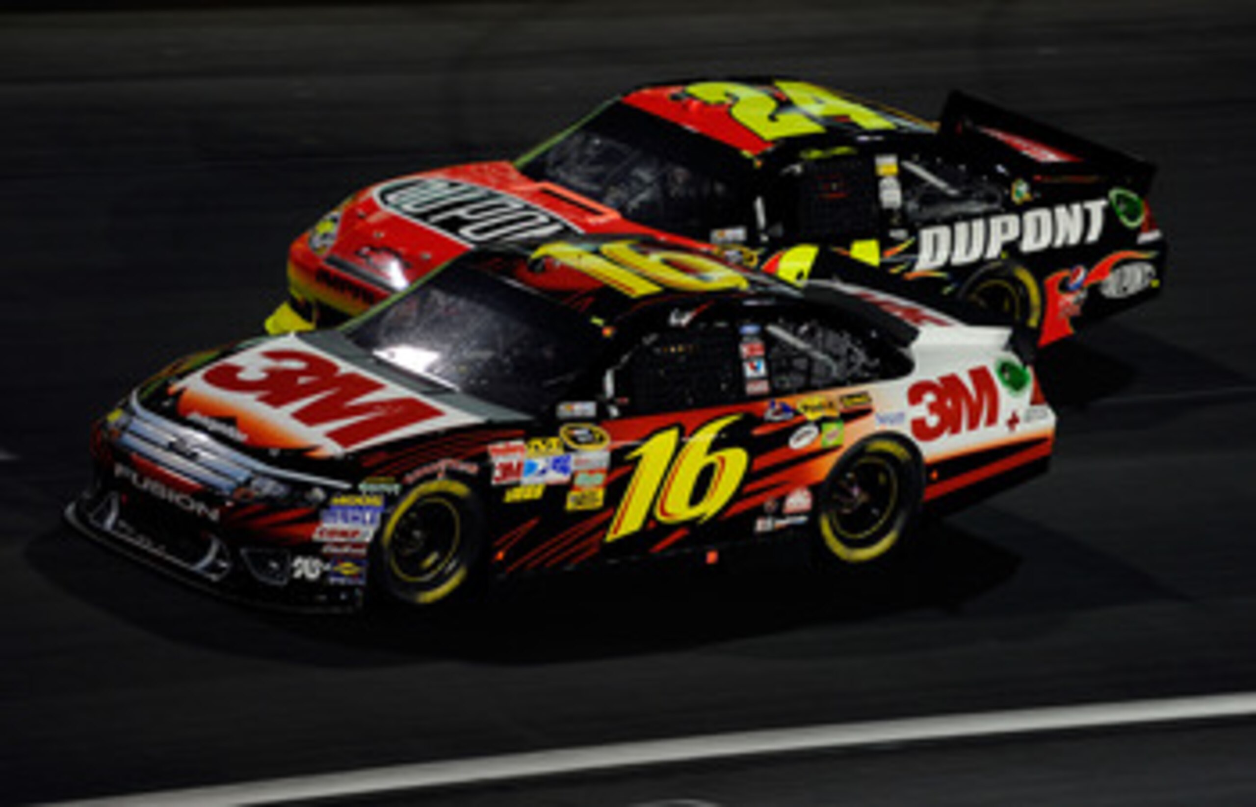 CHARLOTTE, NC - MAY 21:  Greg Biffle, driver of the #16 3M Ford, races Jeff Gordon, driver of the #24 DuPont Chevrolet, during the NASCAR Sprint All-Star Race at Charlotte Motor Speedway on May 21, 2011 in Charlotte, North Carolina.  (Photo by John Harrel
