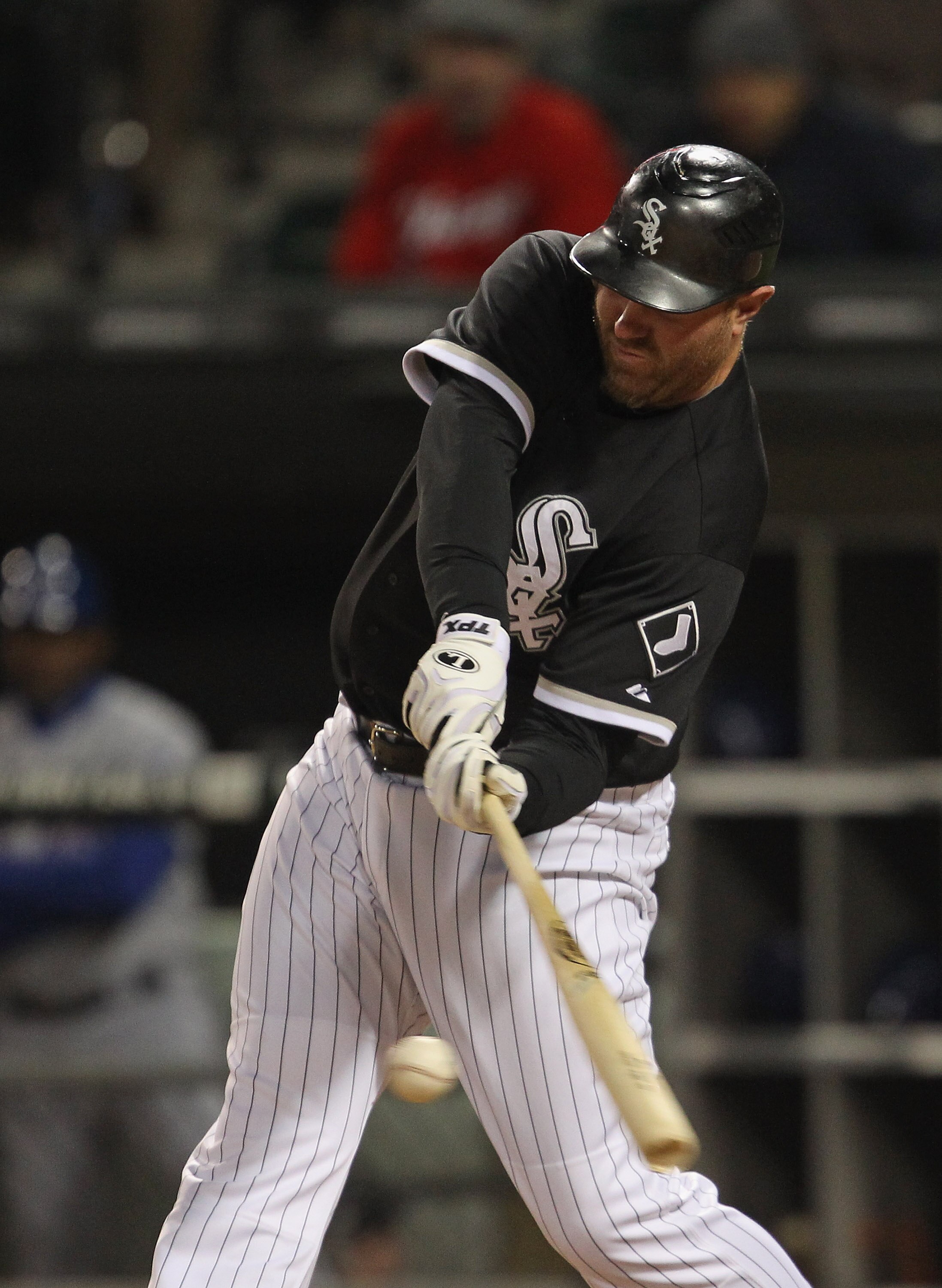 CHICAGO, IL - MAY 16: Adam Dunn #32 of the Chicago White Sox hits the ball against the Texas Rangers at U.S. Cellular Field on May 16, 2011 in Chicago, Illinois. The Rangers defeated the White Sox 4-0. (Photo by Jonathan Daniel/Getty Images)