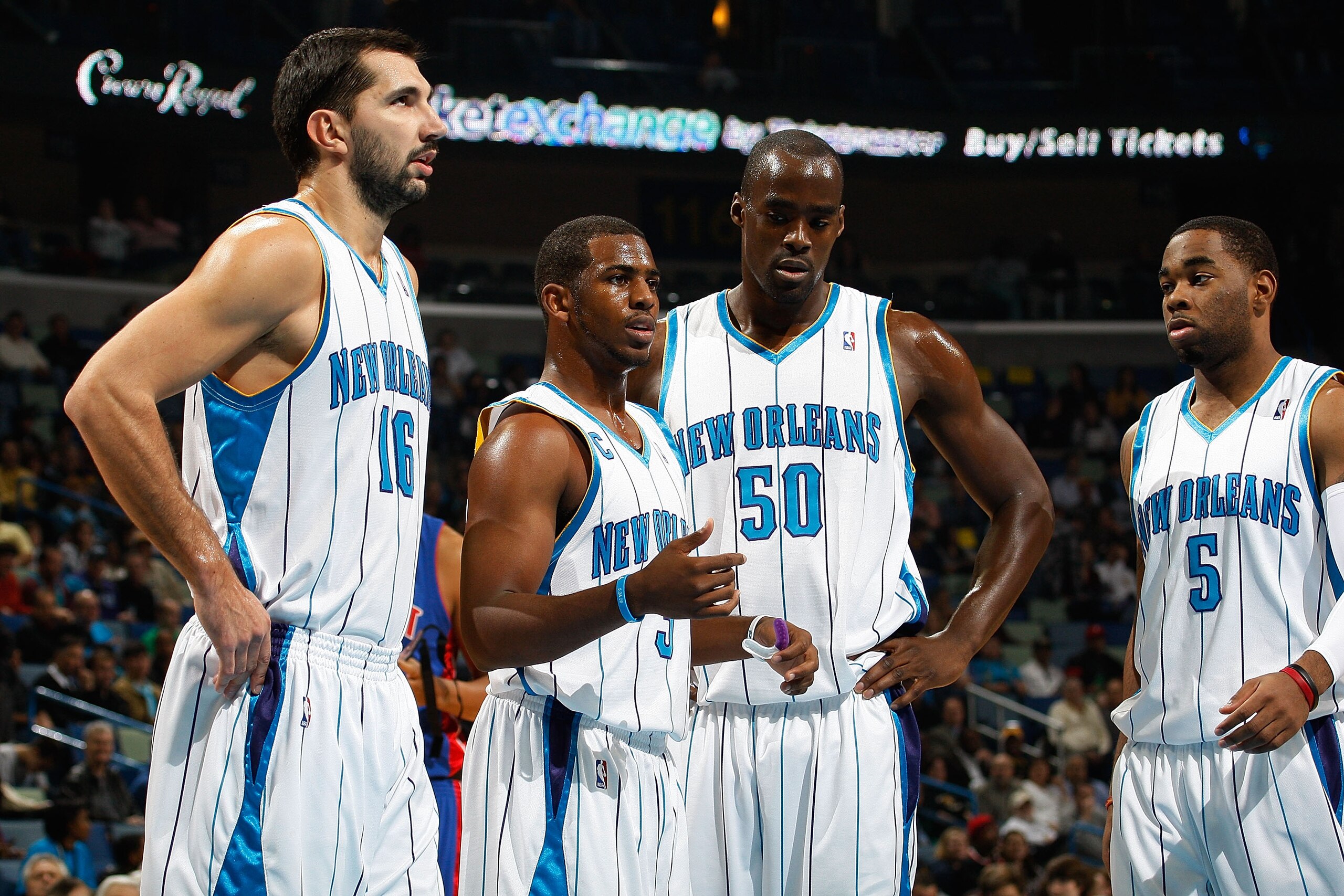 NEW ORLEANS - DECEMBER 16:  Peja Stojakovic #16, Chris Paul #3 Emeka Okafor #50 and Marcus Thornton #5 of the New Orleans Hornets talk  during the game against the Detroit Pistons at New Orleans Arena on December 16, 2009 in New Orleans, Louisiana. The Ho