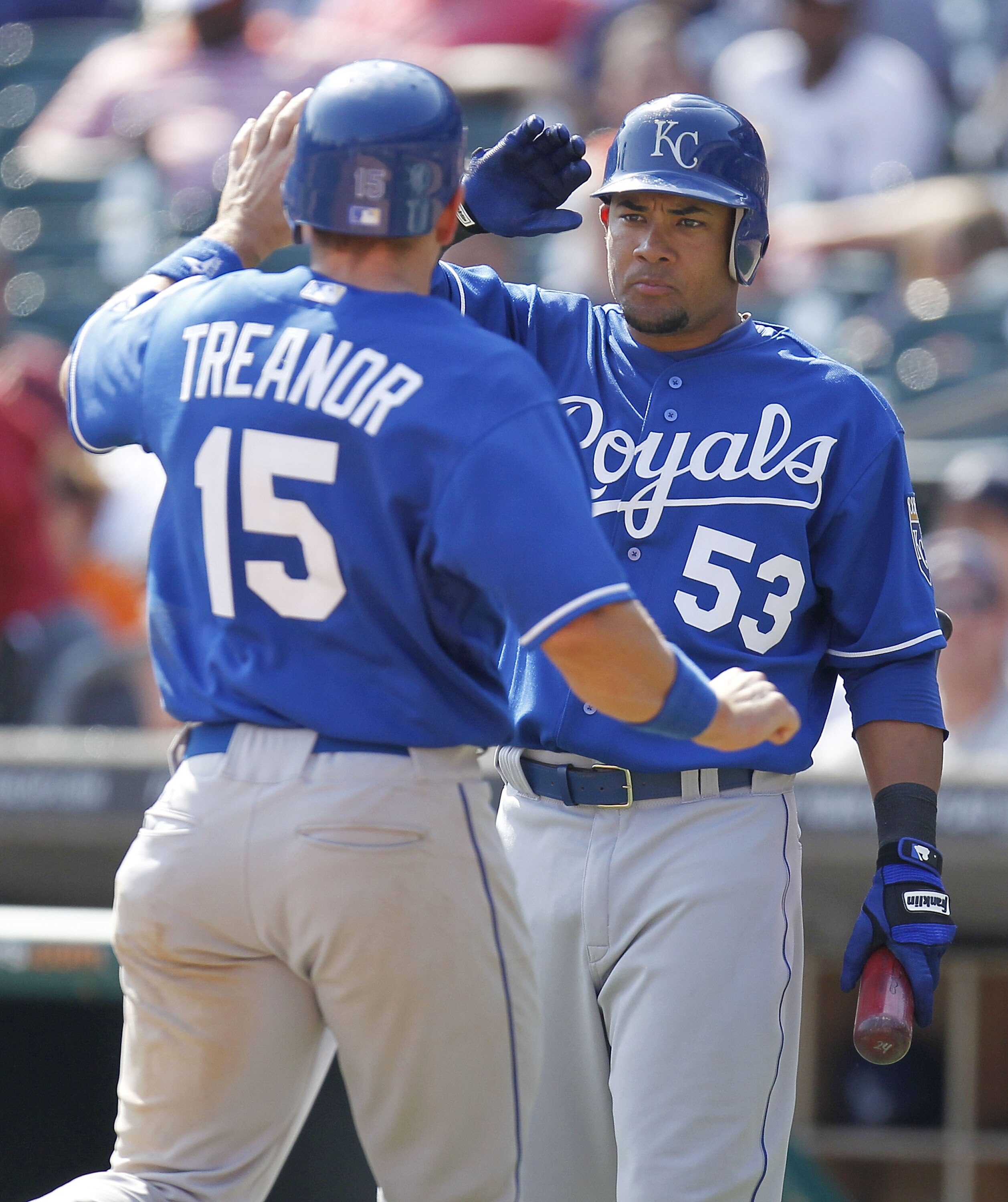 DETROIT, MI - APRIL 10: Melky Cabrera #53 of the Kansas City Royals high fives Matt Treanor #15 after he scored in the ninth inning while playing the Detroit Tigers at Comerica Park on April 10, 2011 in Detroit, Michigan.  (Photo by Gregory Shamus/Getty I