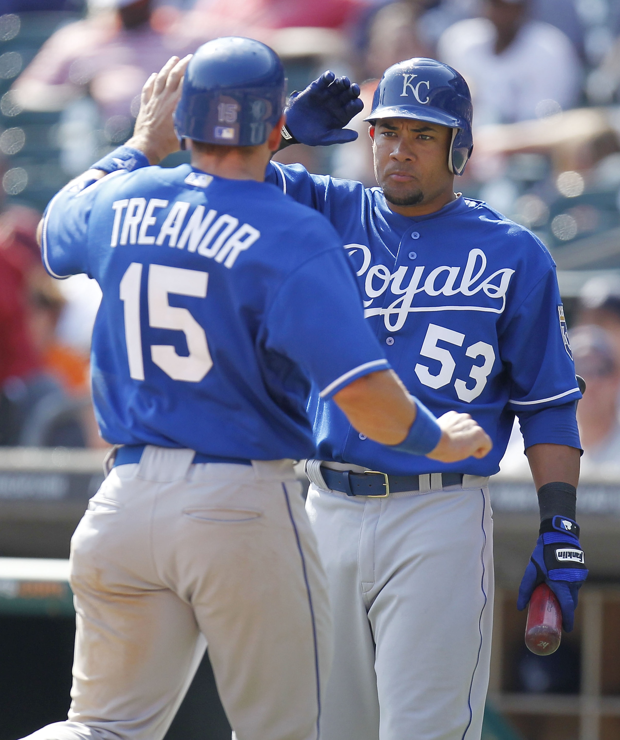 DETROIT, MI - APRIL 10: Melky Cabrera #53 of the Kansas City Royals high fives Matt Treanor #15 after he scored in the ninth inning while playing the Detroit Tigers at Comerica Park on April 10, 2011 in Detroit, Michigan.  (Photo by Gregory Shamus/Getty I