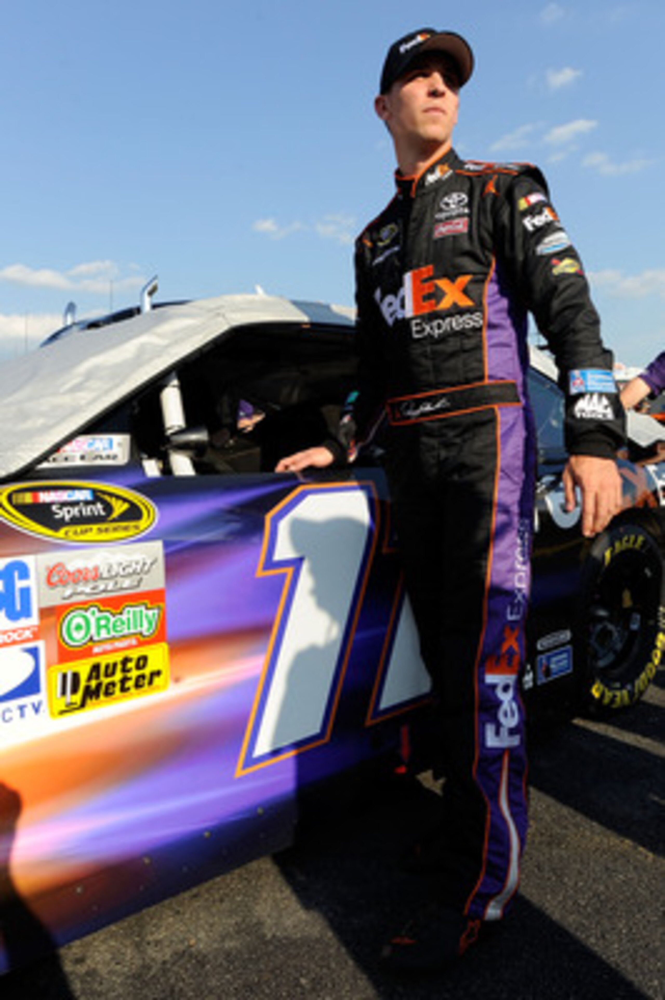 CHARLOTTE, NC - MAY 20:  Denny Hamlin, driver of the #11 FedEx Express Toyota, looks on during qualifying for the NASCAR Sprint All-Star Race at Charlotte Motor Speedway on May 20, 2011 in Charlotte, North Carolina.  (Photo by John Harrelson/Getty Images 