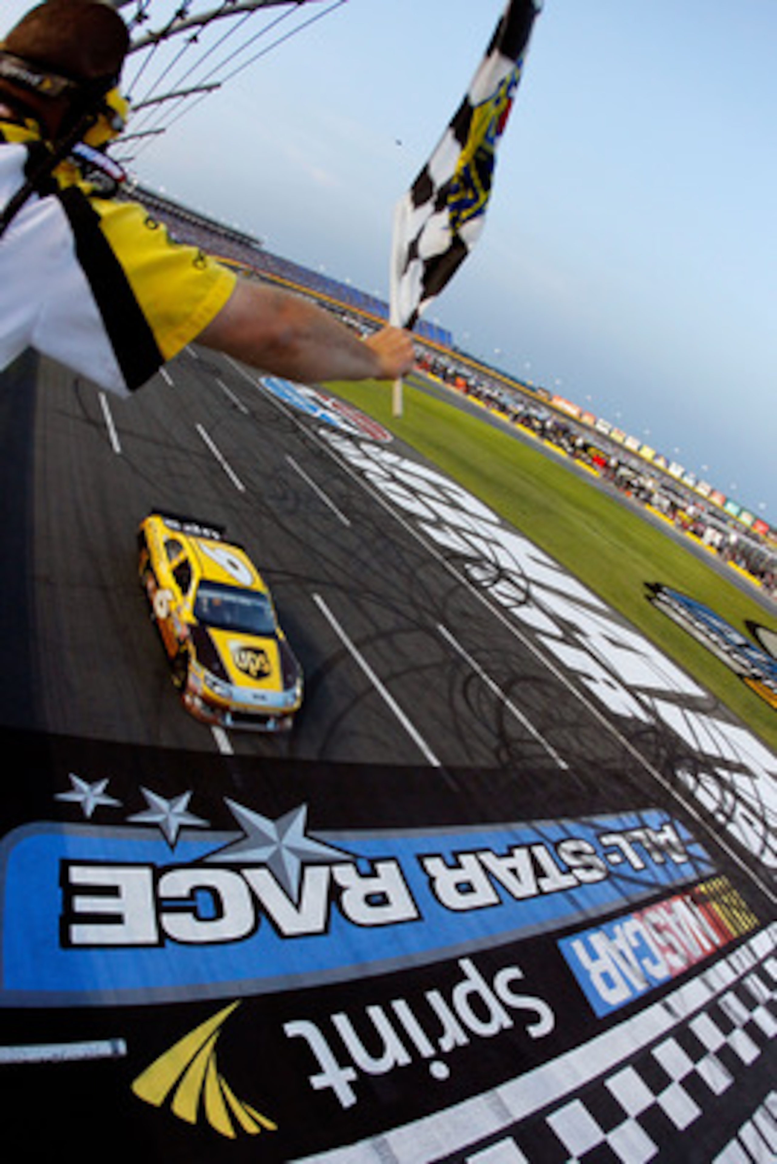 CHARLOTTE, NC - MAY 21:  David Ragan, driver of the #6 UPS Ford, comes to the finish line to win the NASCAR Sprint Showdown at Charlotte Motor Speedway on May 21, 2011 in Charlotte, North Carolina.  (Photo by Pool/Getty Images for NASCAR)