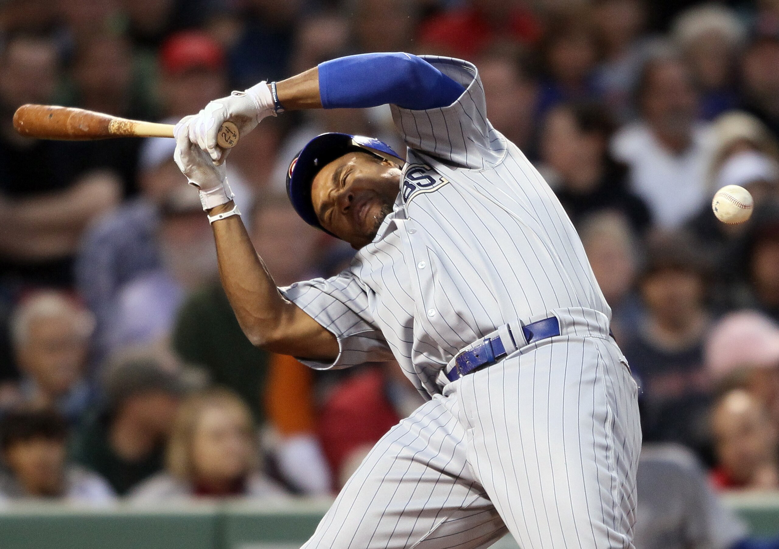 BOSTON, MA - MAY 21:  Marlon Byrd #24 of the Chicago Cubs is hits a in the head by a pitch in the second inning against the Boston Red Sox  on May 21, 2011 at Fenway Park in Boston, Massachusetts. Tonight the Chicago Cubs and the Boston Red Sox are wearin