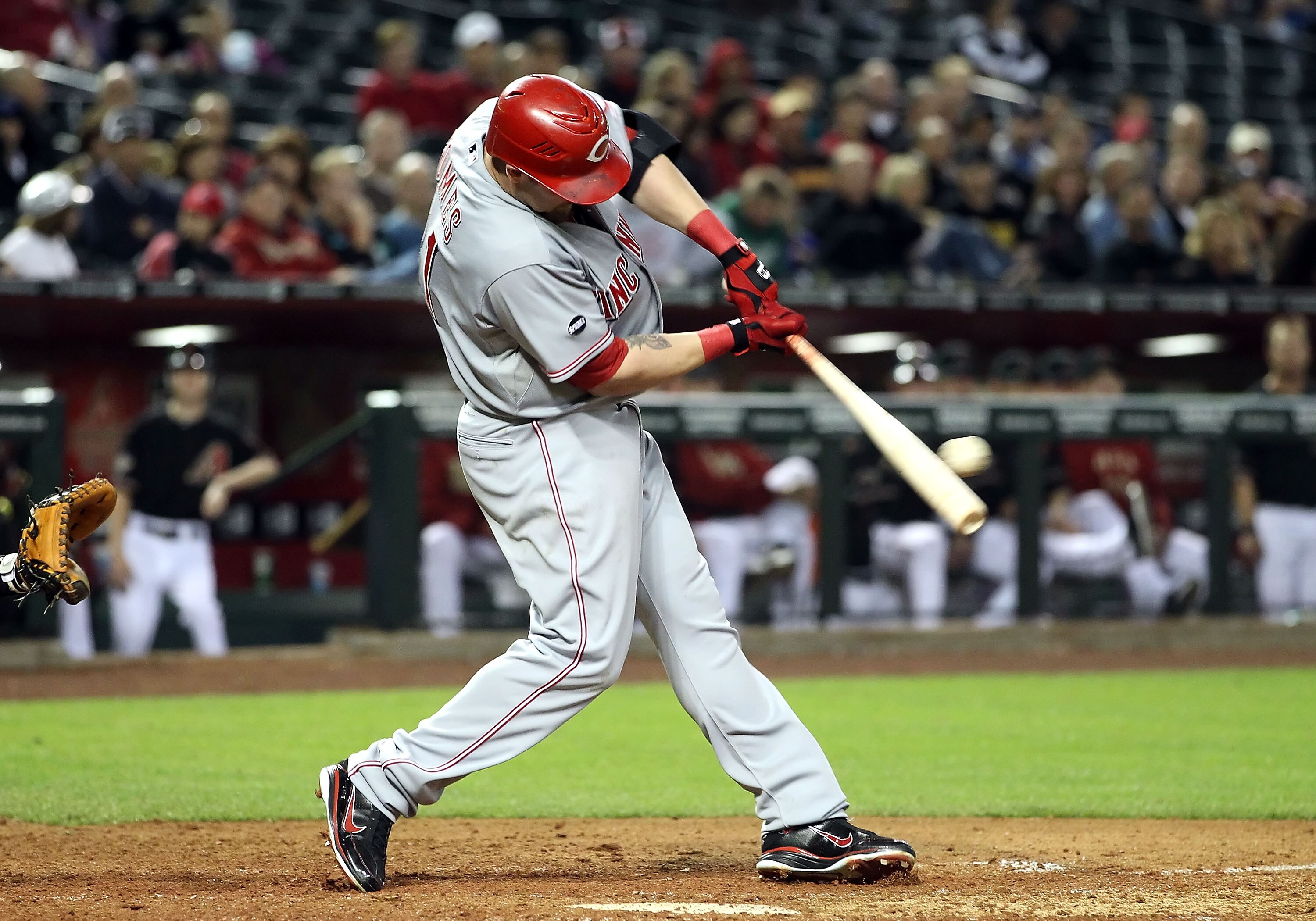 PHOENIX, AZ - APRIL 09:  Jonny Gomes #31 of the Cincinnati Reds hits a 2 RBI double against the Arizona Diamondbacks during the ninth inning of the Major League Baseball game at Chase Field on April 9, 2011 in Phoenix, Arizona.  (Photo by Christian Peters