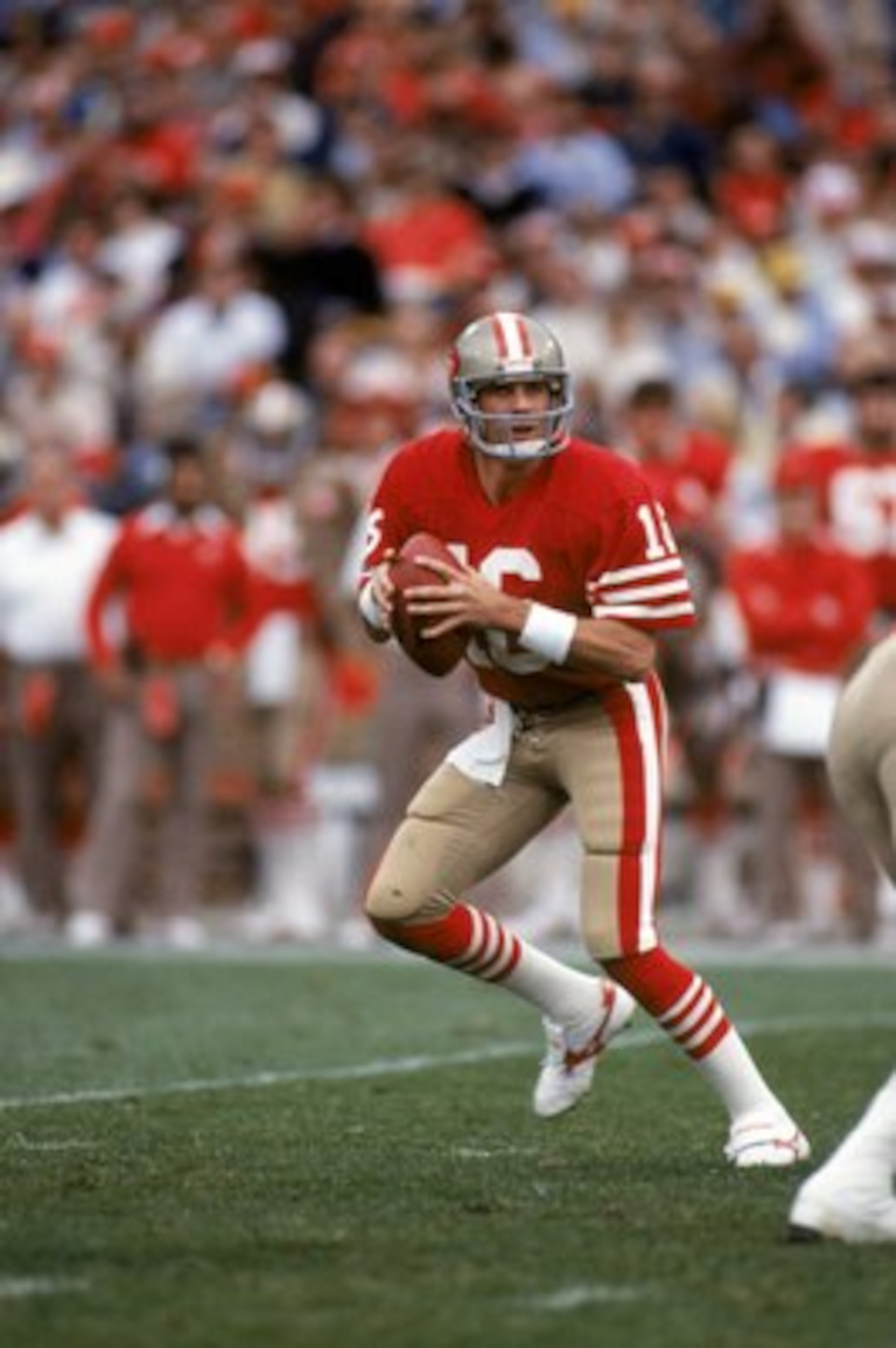 SAN FRANCISCO - DECEMBER 8:  Quarterback Joe Montana #16 of the San Francisco 49ers drops back to pass during a game against the Minnesota Vikings at Candlestick Park on December 8, 1984 in San Francisco, California.  The 49ers won 51-7.  (Photo by George