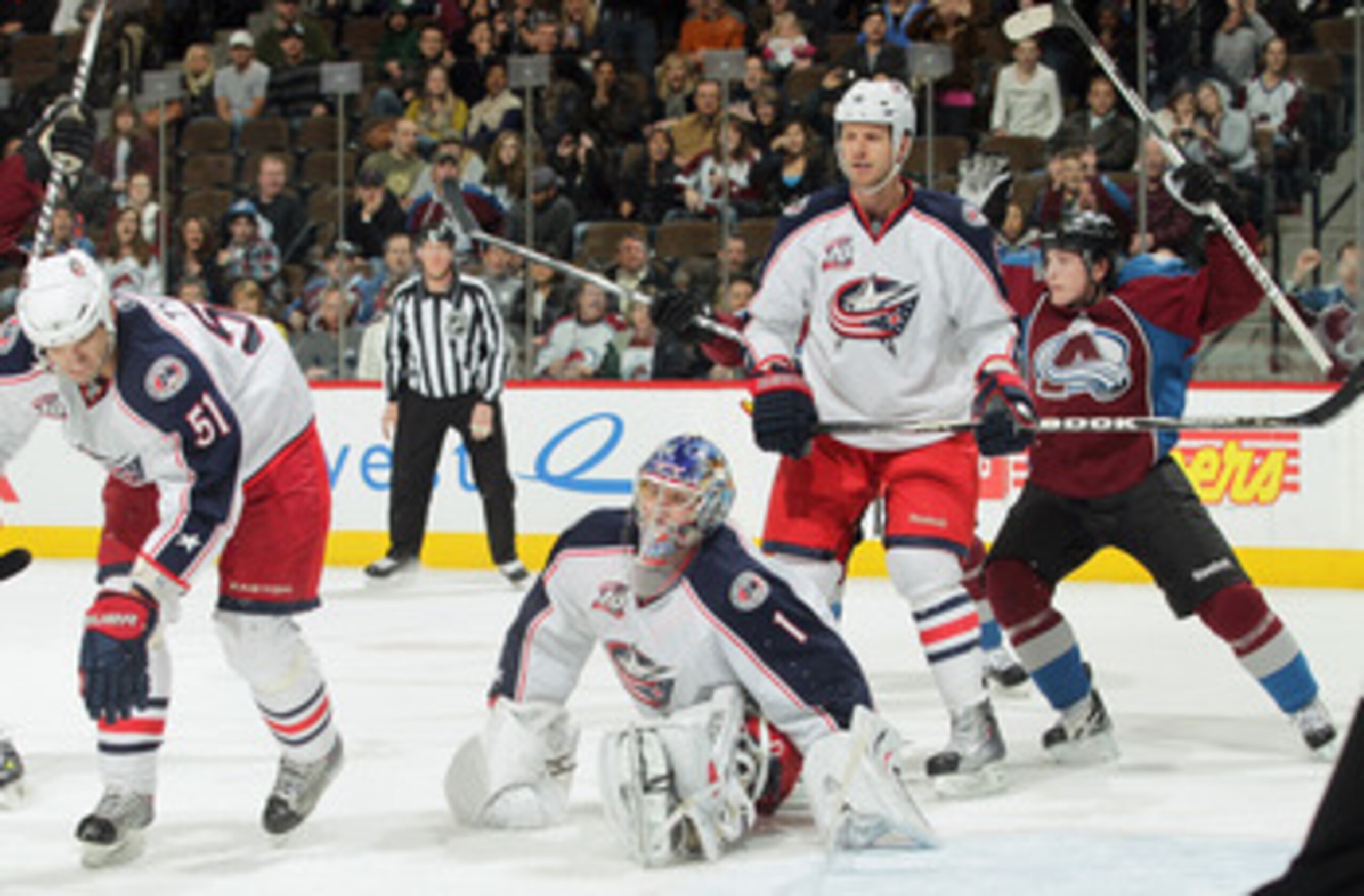 DENVER, CO - MARCH 22:  Goalie Steve Mason #1 of the Columbus Blue Jackets reacts and Matt Duchene #9 of the Colorado Avalanche celebrates after a shot by Daniel Winnik of the Colorado Avalanche scores with three seconds left in the game to tie the score 