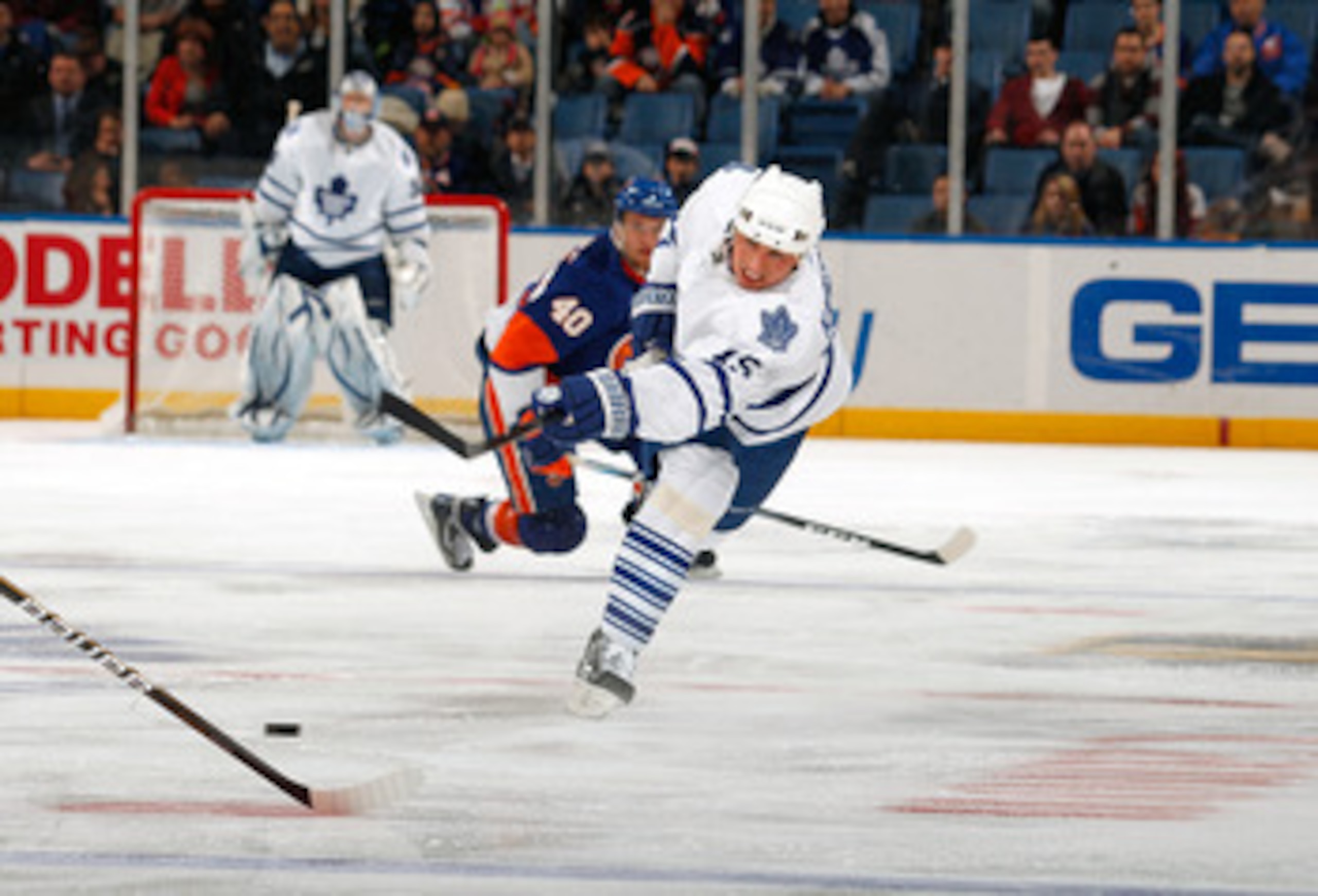 UNIONDALE, NY - FEBRUARY 08:  Tomas Kaberle #15 of the Toronto Maple Leafs takes a shot against the New York Islanders on February 8, 2011 at Nassau Colsium in Uniondale, New York.  (Photo by Lou Capozzola/Getty Images)