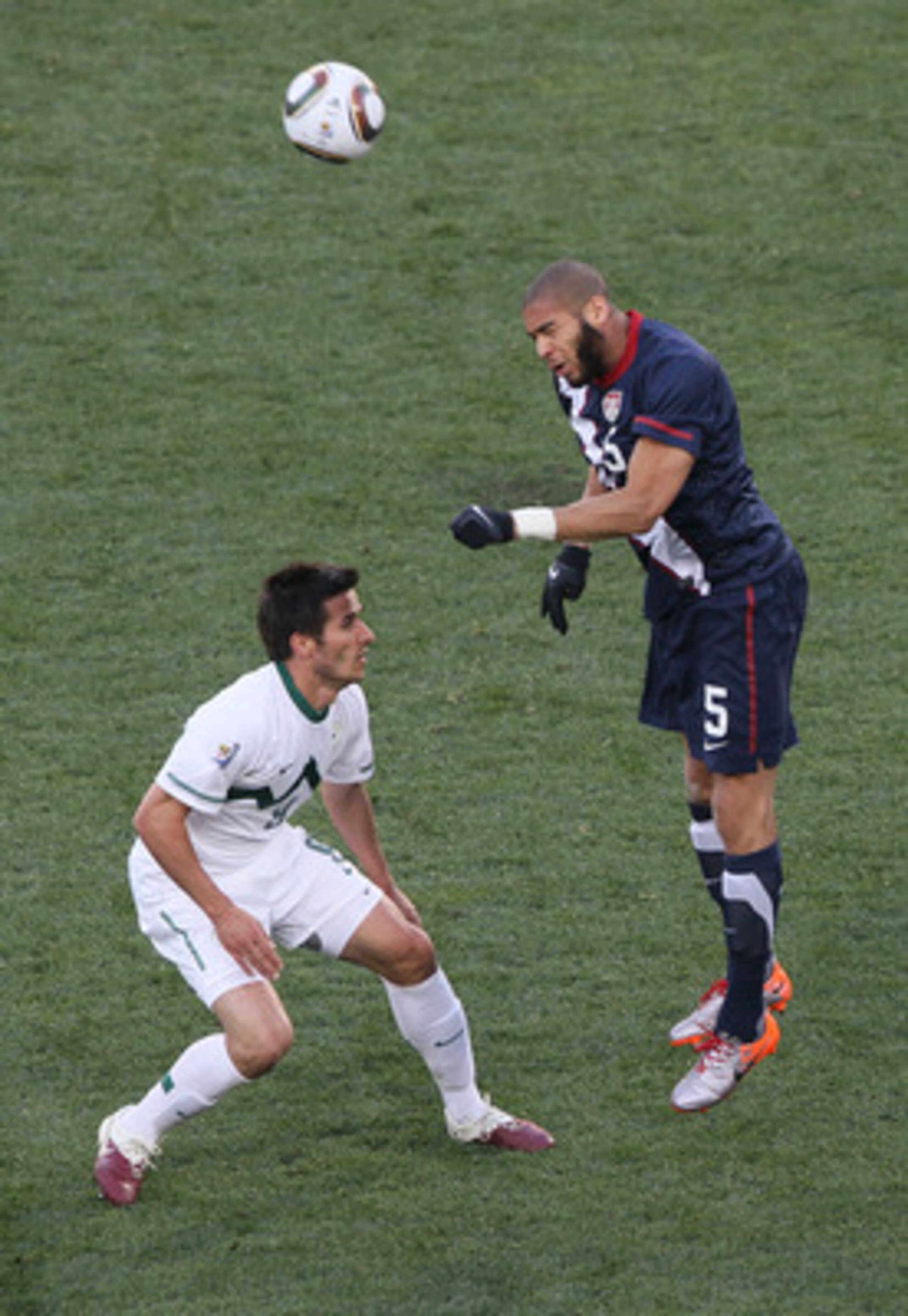 JOHANNESBURG, SOUTH AFRICA - JUNE 18:  Oguchi Onyewu of the United States wins the header under pressure from Zlatan Ljubijankic of Slovenia during the 2010 FIFA World Cup South Africa Group C match between Slovenia and USA at Ellis Park Stadium on June 1
