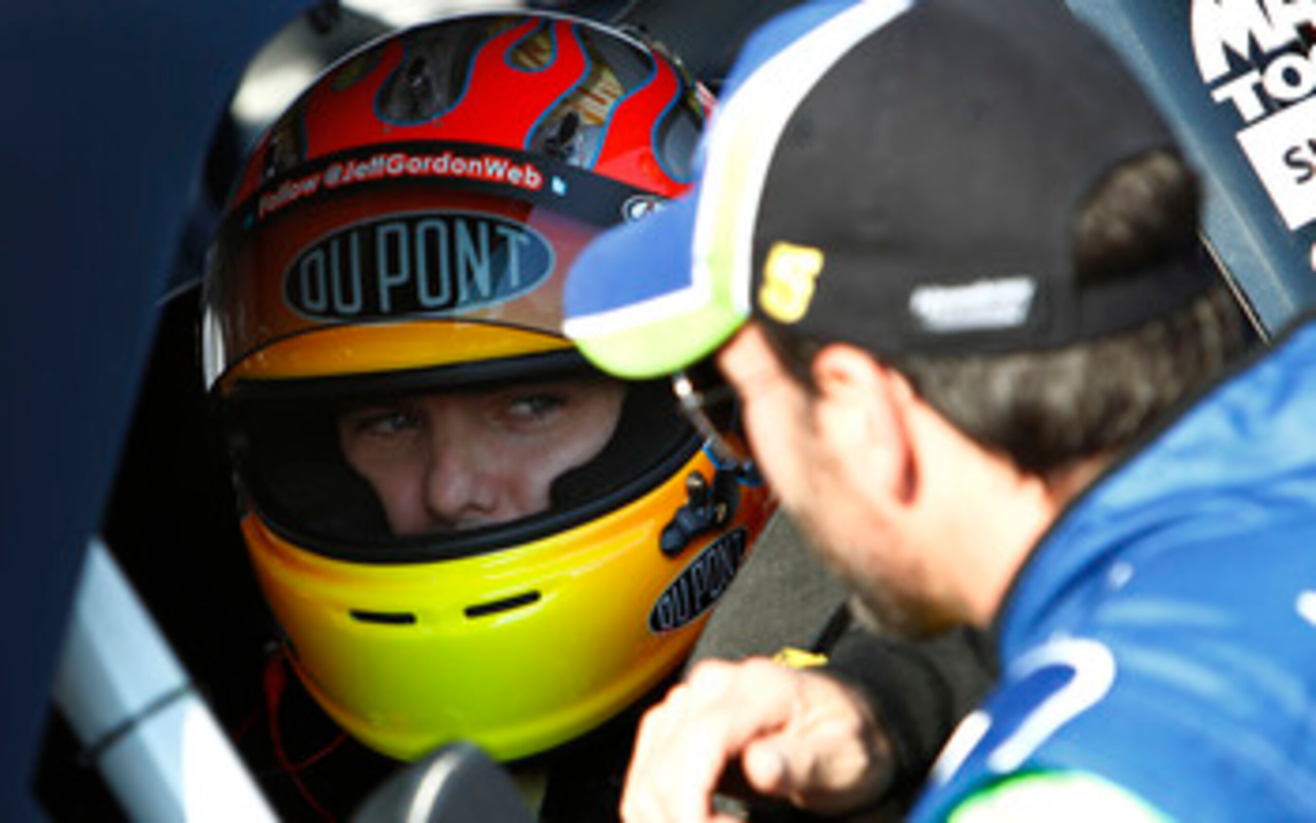 CHARLOTTE, NC - MAY 20:  Jimmie Johnson (R) , driver of the #5 Lowe's 5% Every Day Chevrolet, talks to Jeff Gordon (L), driver of the #24 DuPont Chevrolet, on the grid during qualifying for the NASCAR Sprint All-Star Race at Charlotte Motor Speedway on Ma