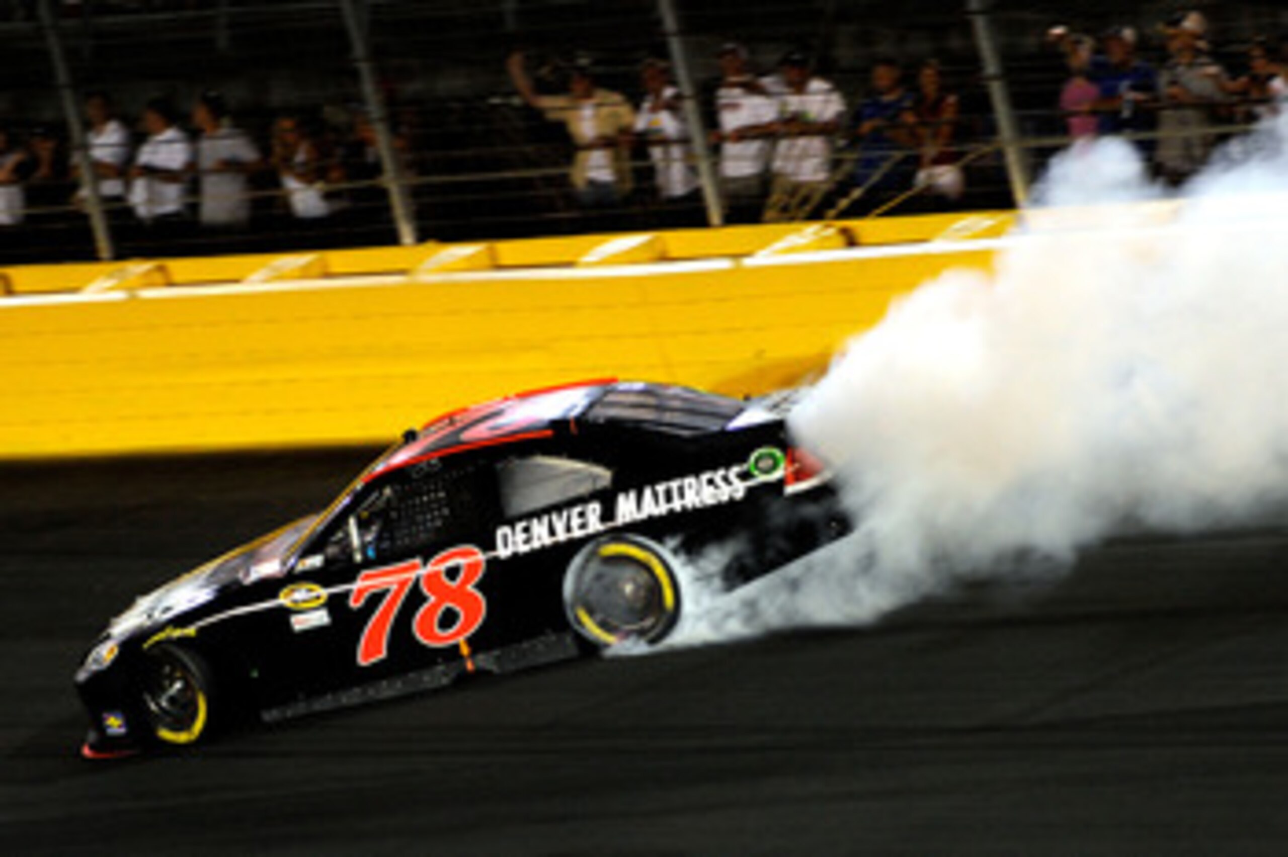 CHARLOTTE, NC - MAY 21:  Regan Smith, driver of the #78 Furniture Row Companies Chevrolet, loses control of his car during the NASCAR Sprint All-Star Race at Charlotte Motor Speedway on May 21, 2011 in Charlotte, North Carolina.  (Photo by John Harrelson/