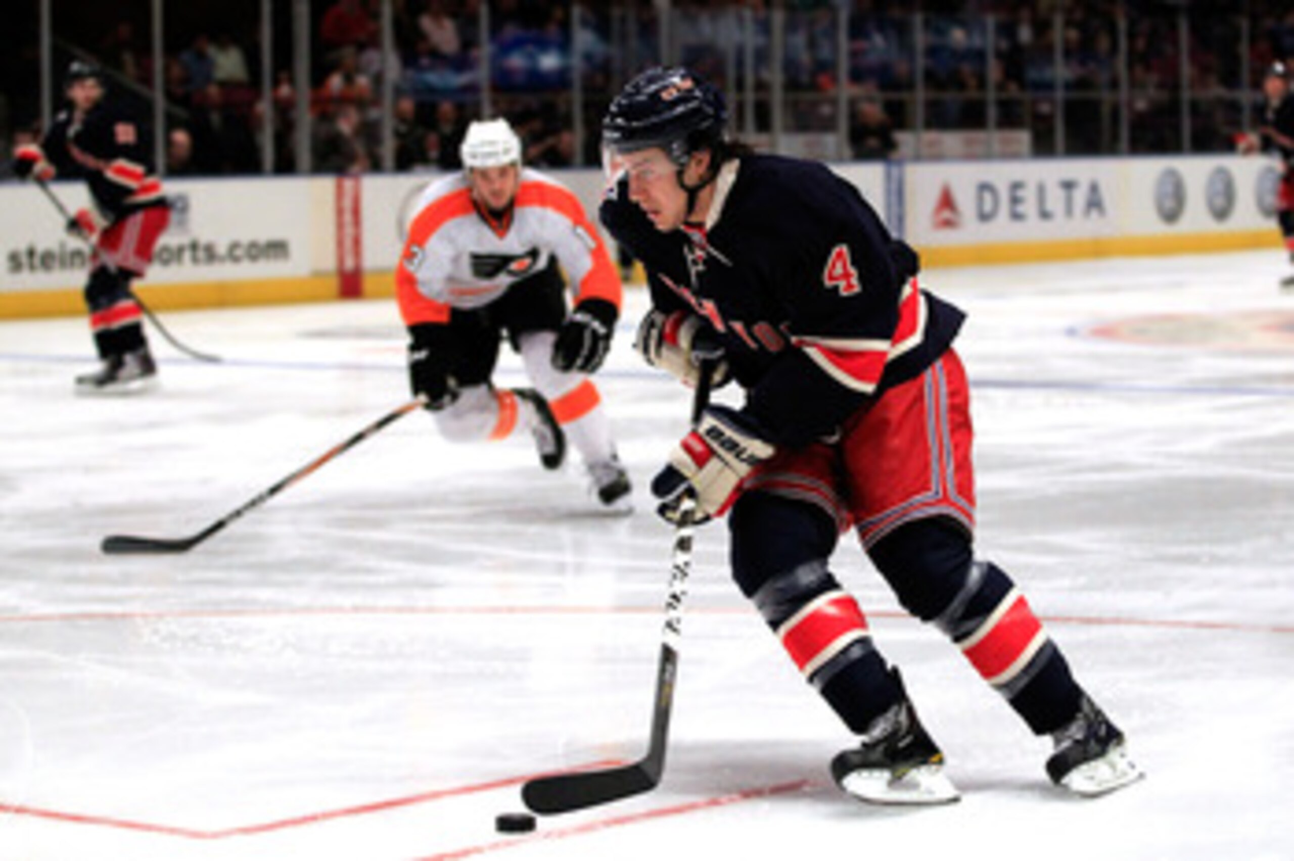 NEW YORK, NY - FEBRUARY 20:  Michael Del Zotto #4 of the New York Rangers controls the puck against the Philadelpia Flyers at Madison Square Garden on February 20, 2011 in New York City. The Flyers defeated the Rangers 4-2. (Photo by Chris Trotman/Getty I