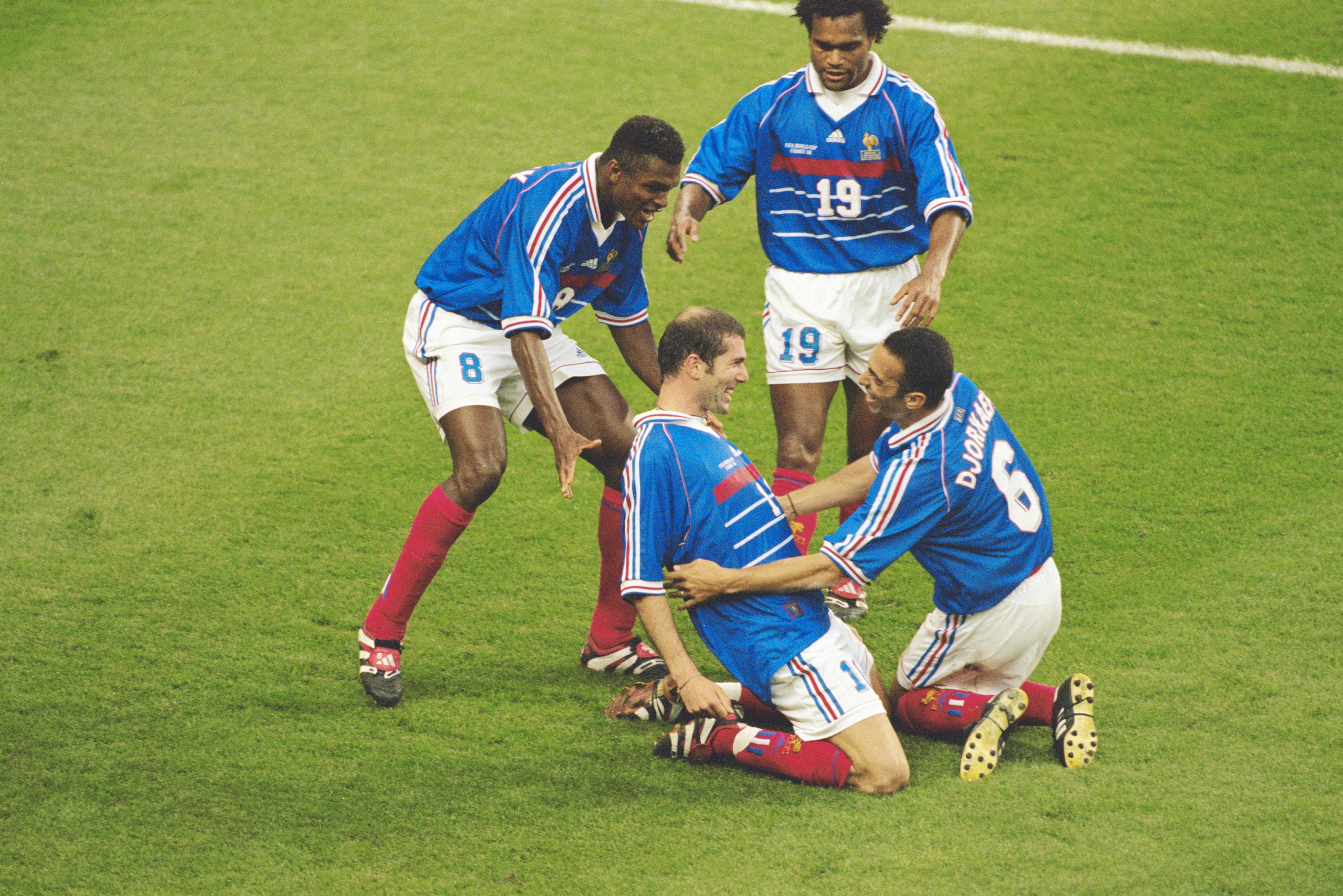 12 Jul 1998:  Zinedine Zidane of France celebrates his goal with team mates (R to L) Youri Djorkaeff, Christian Karembeu and Marcel Desailly during the World Cup Final against Brazil at the Stade de France in St Denis. Zidane scored twice as France won 3-