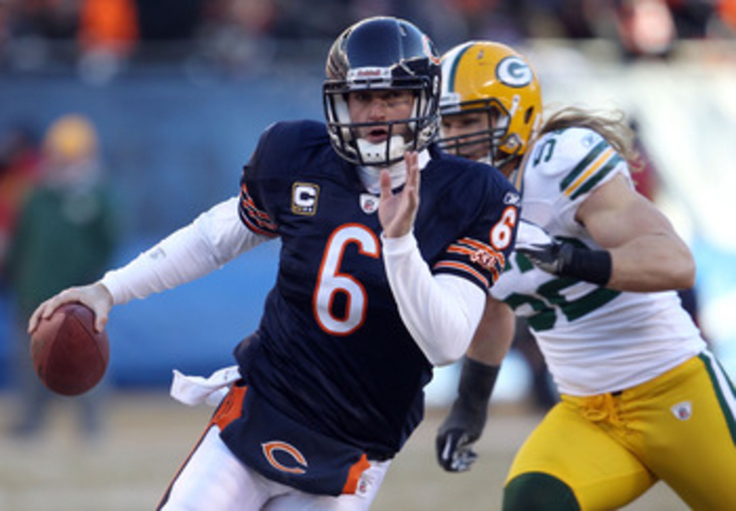 CHICAGO, IL - JANUARY 23:  Quarterback Jay Cutler #6 of the Chicago Bears runs the ball ahead of Clay Matthews #52 of the Green Bay Packers in the second quarter of the NFC Championship Game at Soldier Field on January 23, 2011 in Chicago, Illinois.  (Pho