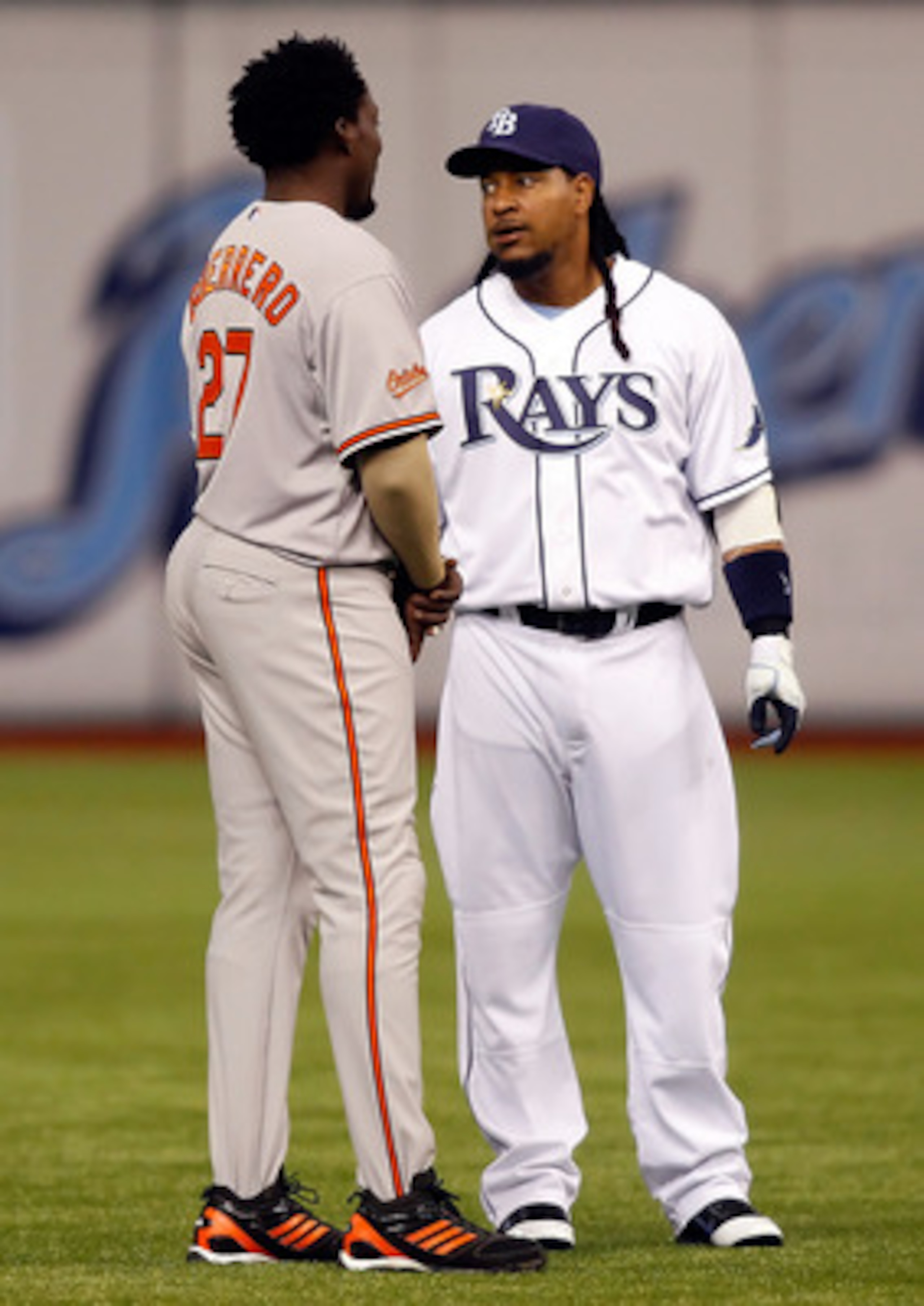 ST. PETERSBURG, FL - APRIL 02: Designated hitter Manny Ramirez #24 of the Tampa Bay Rays talks with designated hitter Vladimir Guerrero #27 of the Baltimore Orioles just before the start of the game at Tropicana Field on April 2, 2011 in St. Petersburg, ST. PETERSBURG, FL - APRIL 02: Designated hitter Manny Ramirez #24 of the Tampa Bay Rays talks with designated hitter Vladimir Guerrero #27 of the Baltimore Orioles just before the start of the game at Tropicana Field on April 2, 2011 in St. Petersburg,