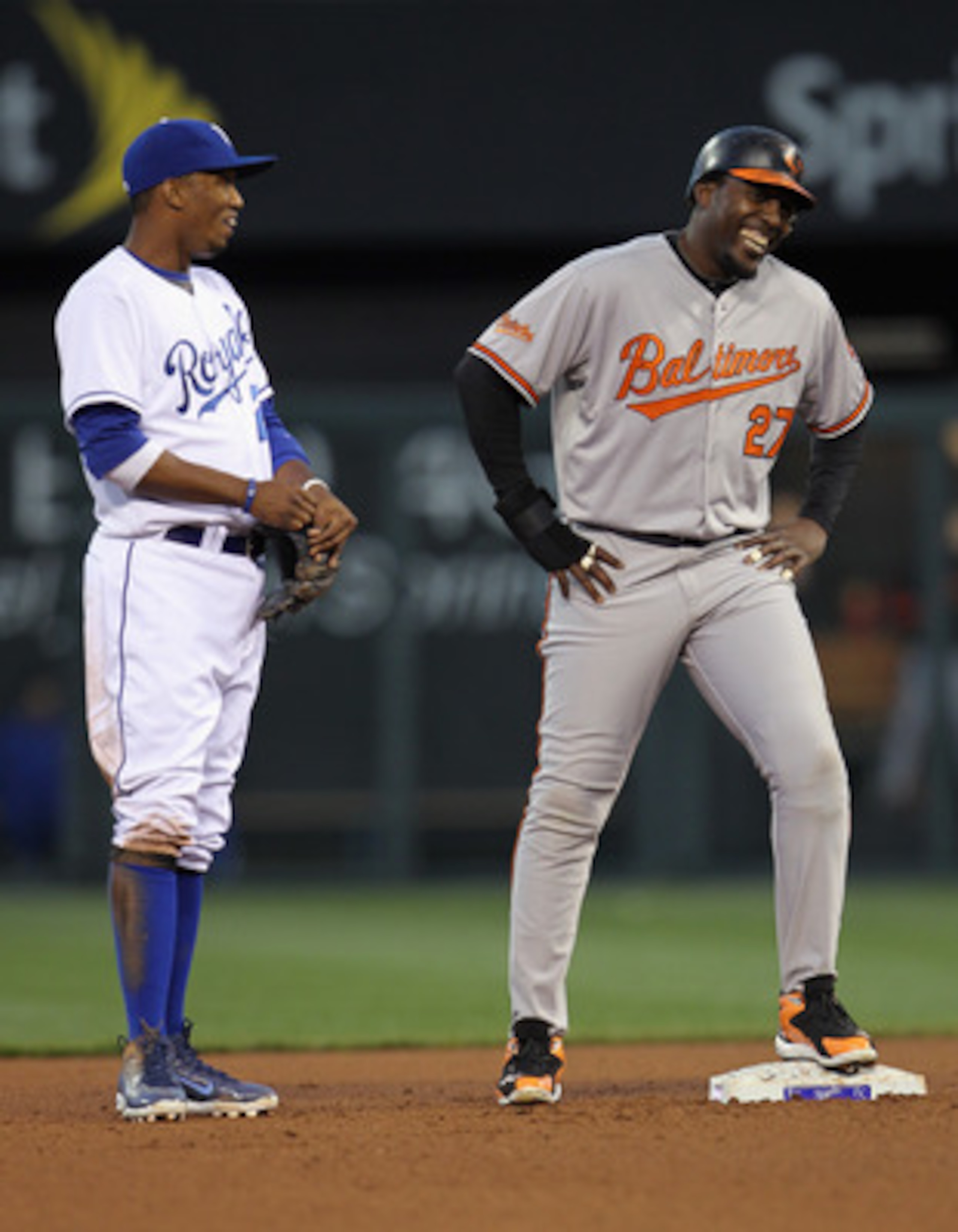 KANSAS CITY, MO - MAY 03: Alcides Escobar #2 of the Kansas City Royals jokes with Vladimir Guerrero #27 of the Baltimore Orioles during the game on May 3, 2011 at Kauffman Stadium in Kansas City, Missouri. (Photo by Jamie Squire/Getty Images) KANSAS CITY, MO - MAY 03: Alcides Escobar #2 of the Kansas City Royals jokes with Vladimir Guerrero #27 of the Baltimore Orioles during the game on May 3, 2011 at Kauffman Stadium in Kansas City, Missouri. (Photo by Jamie Squire/Getty Images)