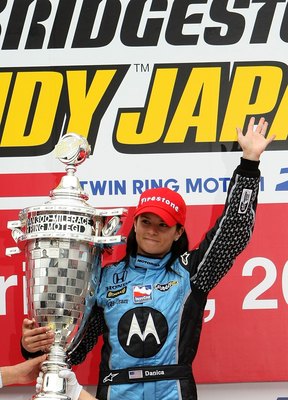 MOTEGI, JAPAN - APRIL 20:  Danica Patrick driver of the #7 Motorola Andretti Green Racing Honda Dallara poses with the trophy after winning the IndyCar Series Bridgestone Indy Japan 300 Mile on April 20, 2008 at Twin Ring Motegi in Motegi, Japan.  (Photo