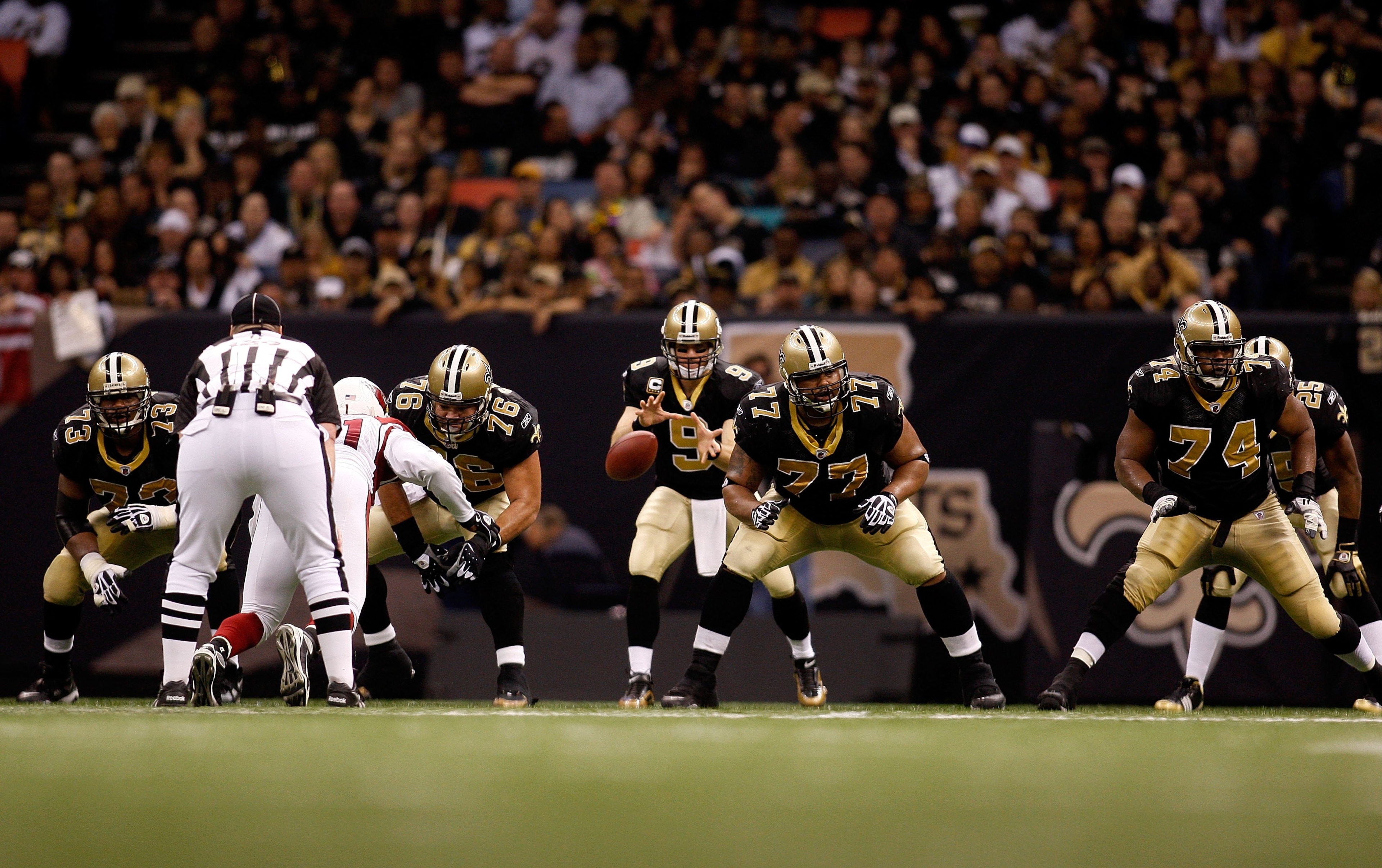 NEW ORLEANS - JANUARY 16: (L-R) Offensive lineman Jahri Evans #73, Jonathan Goodwin #76 Carl Nicks #77 and Jermon Bushrod #74 of the New Orleans Saints pass protect on the snap back to Drew Brees #9 against the Arizona Cardinals during the NFC Divisional NEW ORLEANS - JANUARY 16: (L-R) Offensive lineman Jahri Evans #73, Jonathan Goodwin #76 Carl Nicks #77 and Jermon Bushrod #74 of the New Orleans Saints pass protect on the snap back to Drew Brees #9 against the Arizona Cardinals during the NFC Divisional