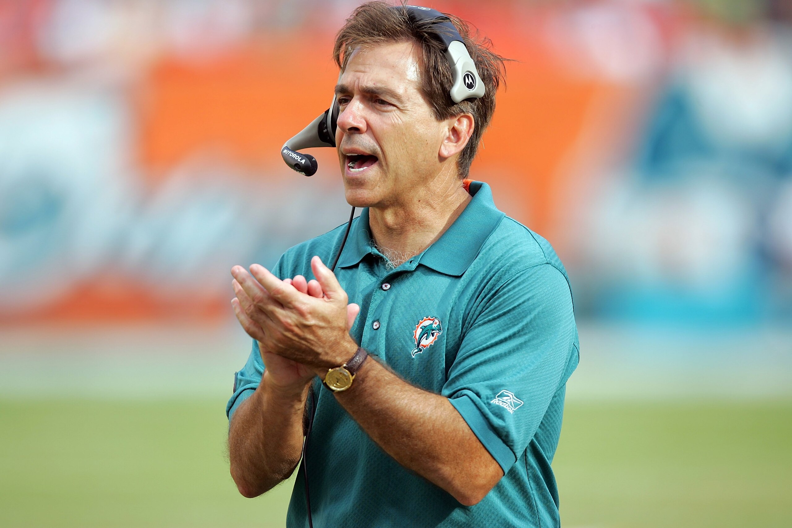 MIAMI - DECEMBER 10:  Head coach Nick Saban of the Miami Dolphins claps for his defense after a key series of downs against the New England Patriots at Dolphin Stadium on December 10, 2006 in Miami, Florida. The Dolphins defeated the Patriots 21-0. (Photo