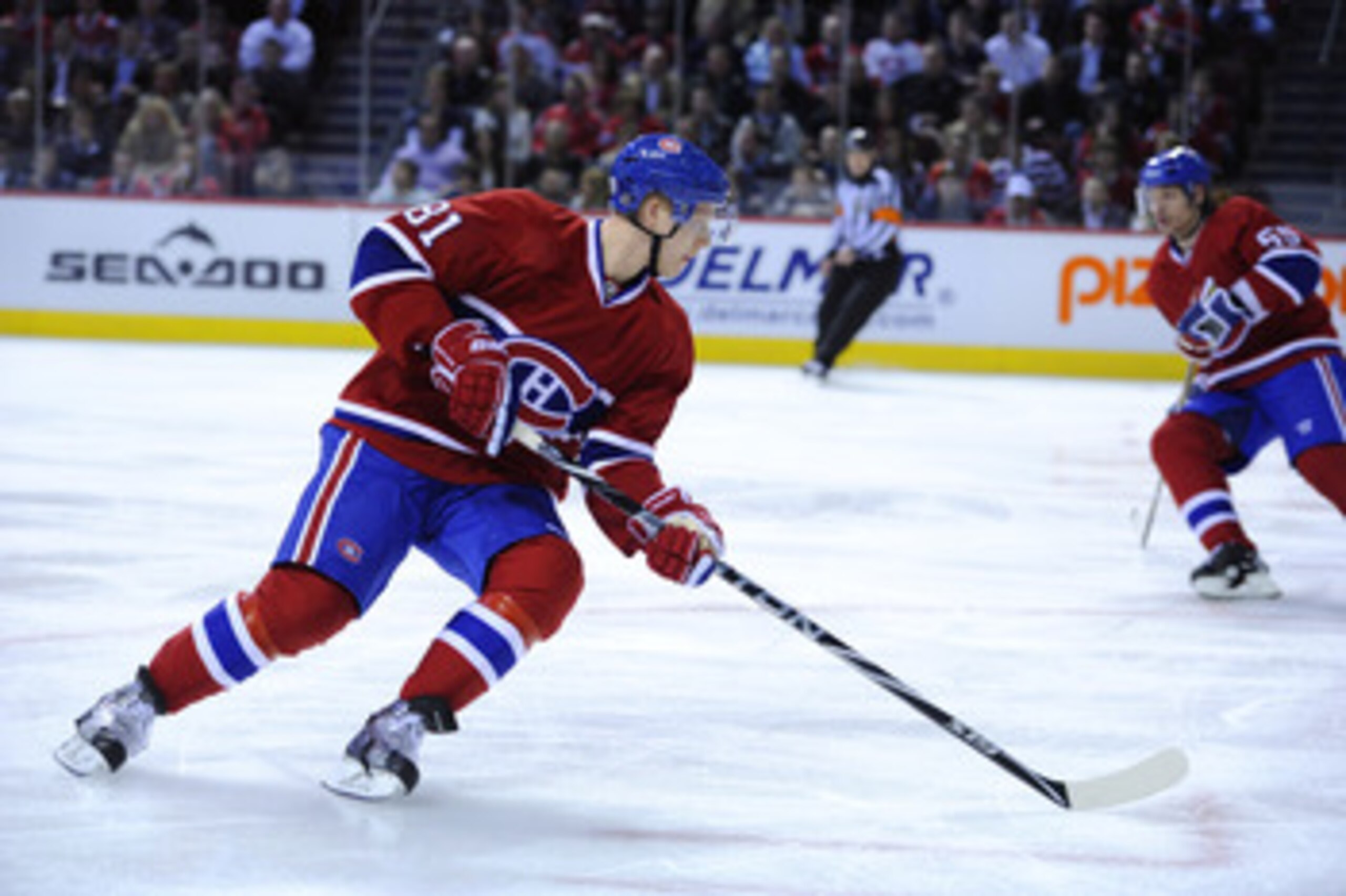 MONTREAL, CANADA - APRIL 21:  Lars Eller #81 of the Montreal Canadiens turns back with the puck in Game Four of the Eastern Conference Quarterfinals against the Boston Bruins during the 2011 NHL Stanley Cup Playoffs at the Bell Centre on April 21, 2011 in