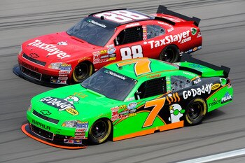 LAS VEGAS, NV - MARCH 05:  Danica Patrick, driver of the #7 GoDaddy.com Chevrolet, races Aric Almirola, driver of the #88 TaxSlayer.com Chevrolet, during the NASCAR Nationwide Series Sam's Town 300 at Las Vegas Motor Speedway on March 5, 2011 in Las Vegas