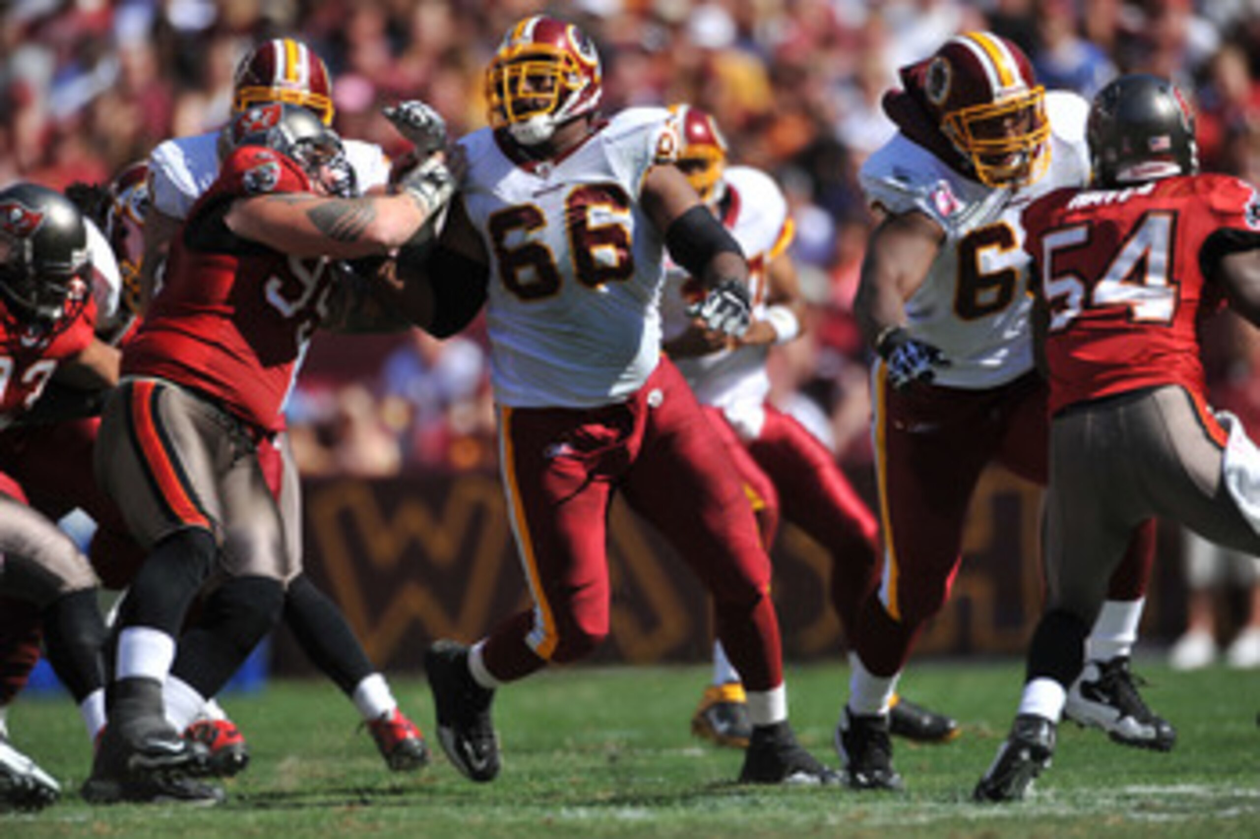 LANDOVER, MD - OCTOBER 4:  Derrick Dockery #66 of the Washington Redskins defends against the Tampa Bay Buccaneers at FedExField on October 4, 2009 in Landover, Maryland. The Redskins defeated the Buccaneers 16-13. (Photo by Larry French/Getty Images)