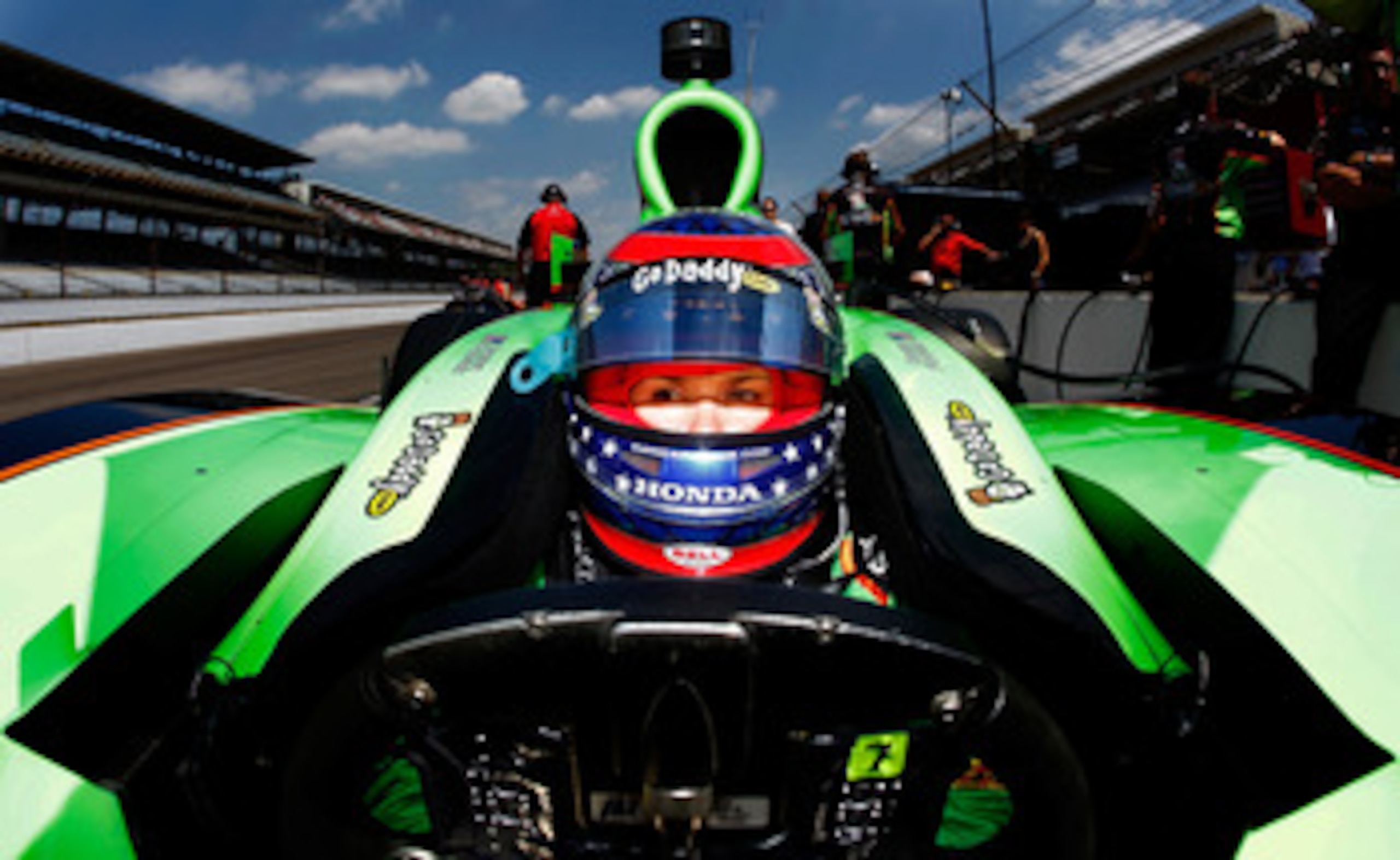 INDIANAPOLIS - MAY 20: Danica Patrick driver of the #7 Team GoDaddy Andretti Autosport Dallara Honda sits in the pits during practice for the the 95th Indianapolis 500 Mile Race at the Indianapolis Motor Speedway on May 20, 2011 in Indianapolis, Indiana. INDIANAPOLIS - MAY 20: Danica Patrick driver of the #7 Team GoDaddy Andretti Autosport Dallara Honda sits in the pits during practice for the the 95th Indianapolis 500 Mile Race at the Indianapolis Motor Speedway on May 20, 2011 in Indianapolis, Indiana.