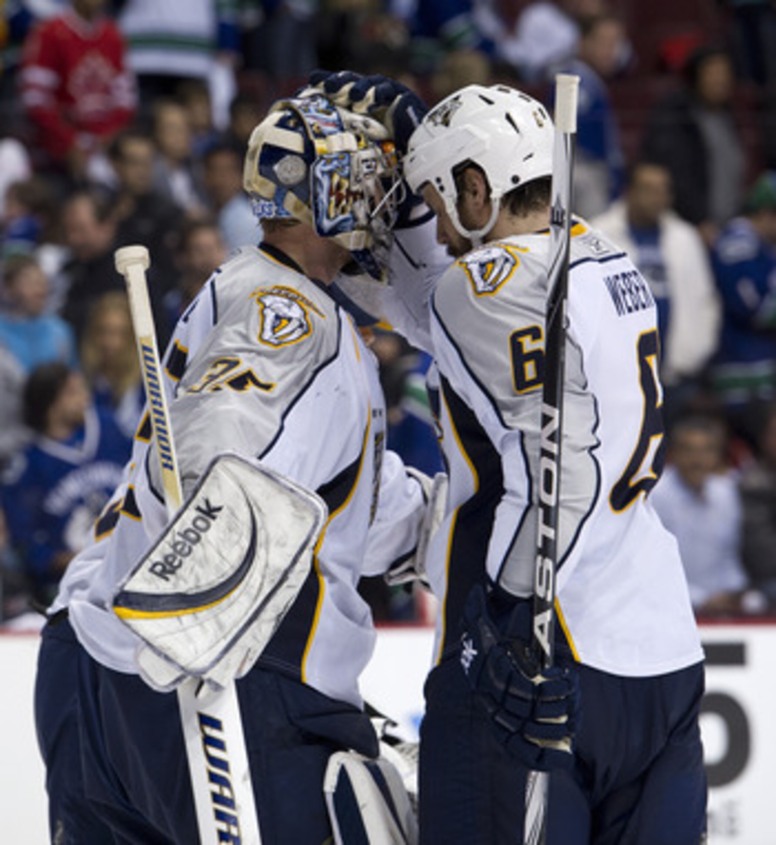 VANCOUVER, CANADA - MAY 7: Goalie Pekka Rinne #35 of the Nashville Predators if congratulated by Shea Weber #6 after defeating the Vancouver Canucks 4-3 in Game Five of the Western Conference Semifinals during the 2011 NHL Stanley Cup Playoffs on May 07, 
