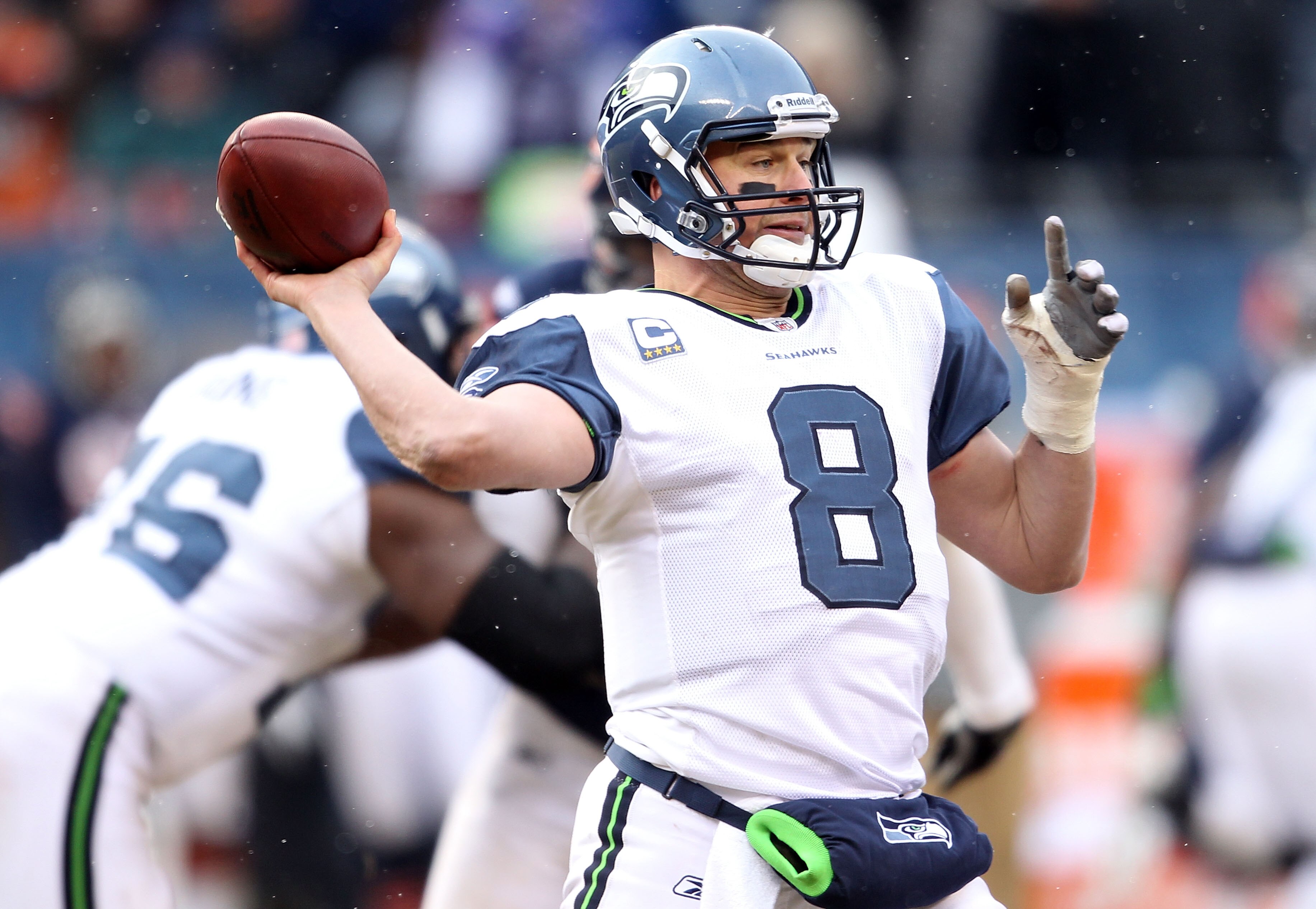 CHICAGO, IL - JANUARY 16:  Quarterback Matt Hasselbeck #8 of the Seattle Seahawks looks to pass against the Chicago Bears in the 2011 NFC divisional playoff game at Soldier Field on January 16, 2011 in Chicago, Illinois.  (Photo by Andy Lyons/Getty Images