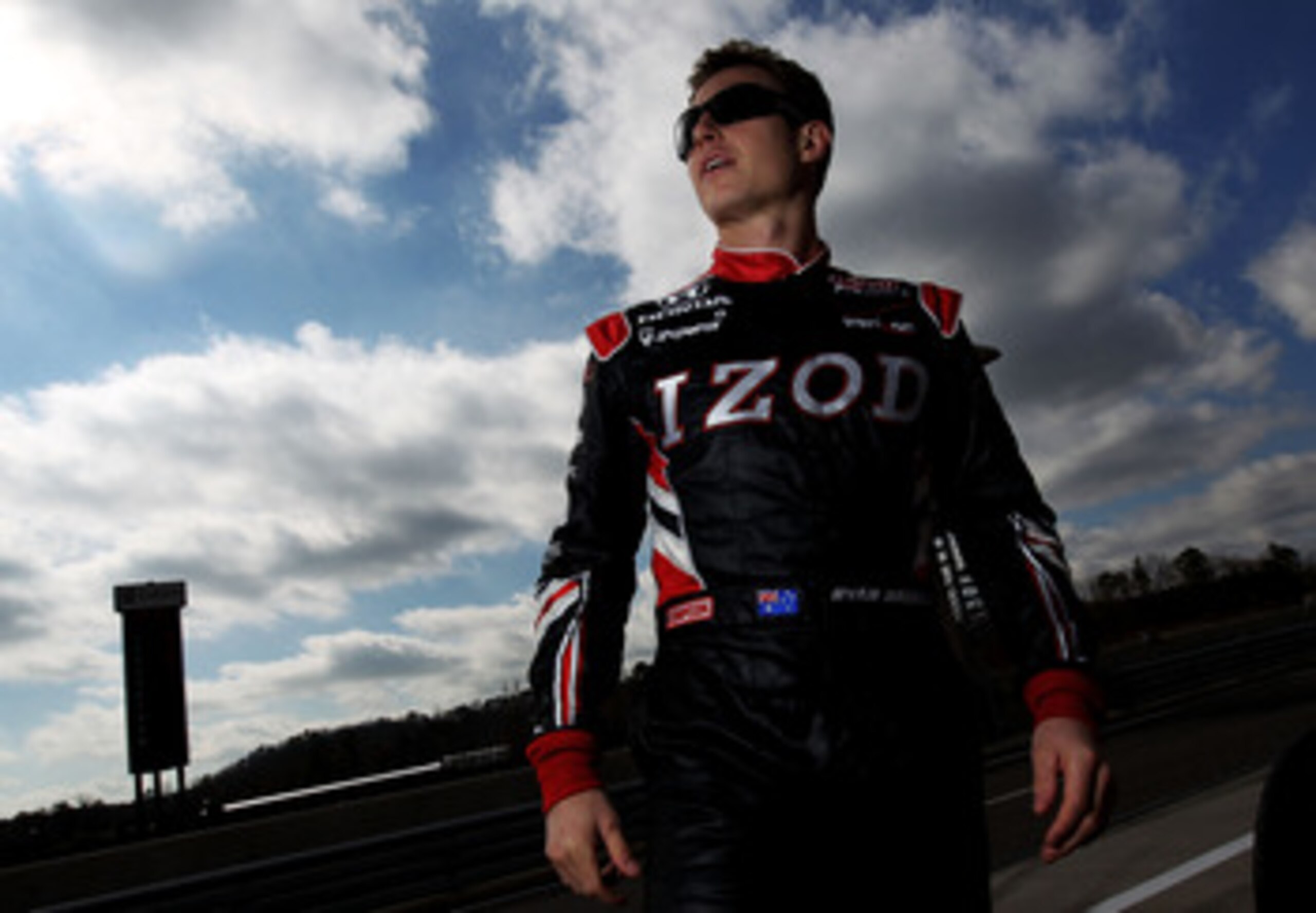 BIRMINGHAM, AL - MARCH 15: Ryan Briscoe of Australia, driver of the #6 Team Penske Dallara Honda stands in pit lane during IZOD IndyCar Series Spring Training at Barber Motorsports Park on March 15, 2011 in Birmingham, Alabama.  (Photo by Nick Laham/Getty