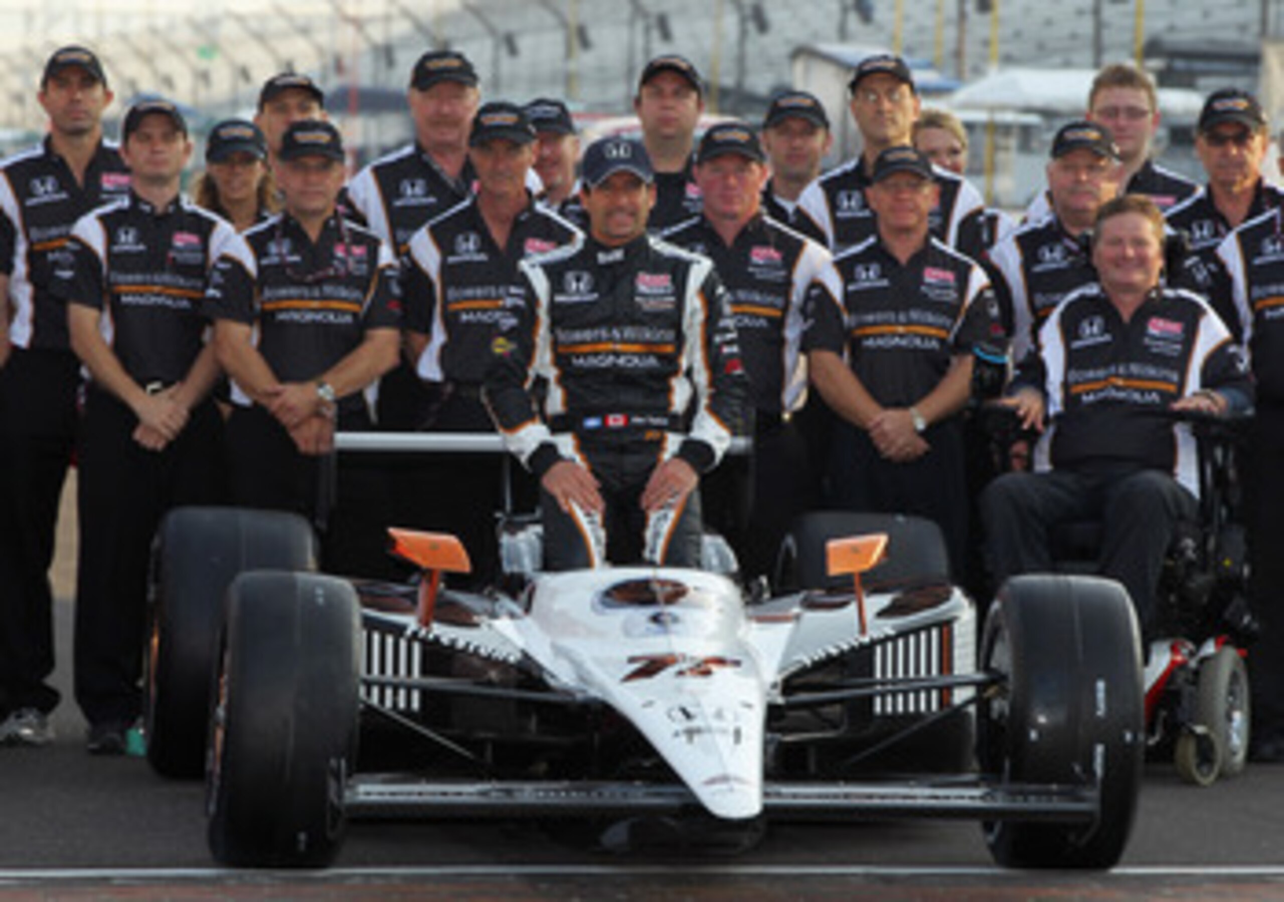 INDIANAPOLIS, IN - MAY 22:  Alex Tagliani of Canada, driver of the #77 Bowers & Wilkins/Sam Schmidt Motorsports Dallara Honda, poses on the finish line after qualifying on the pole for the Indianapolis 500 on May 22, 2011 at Indianapolis Motor Speedway in