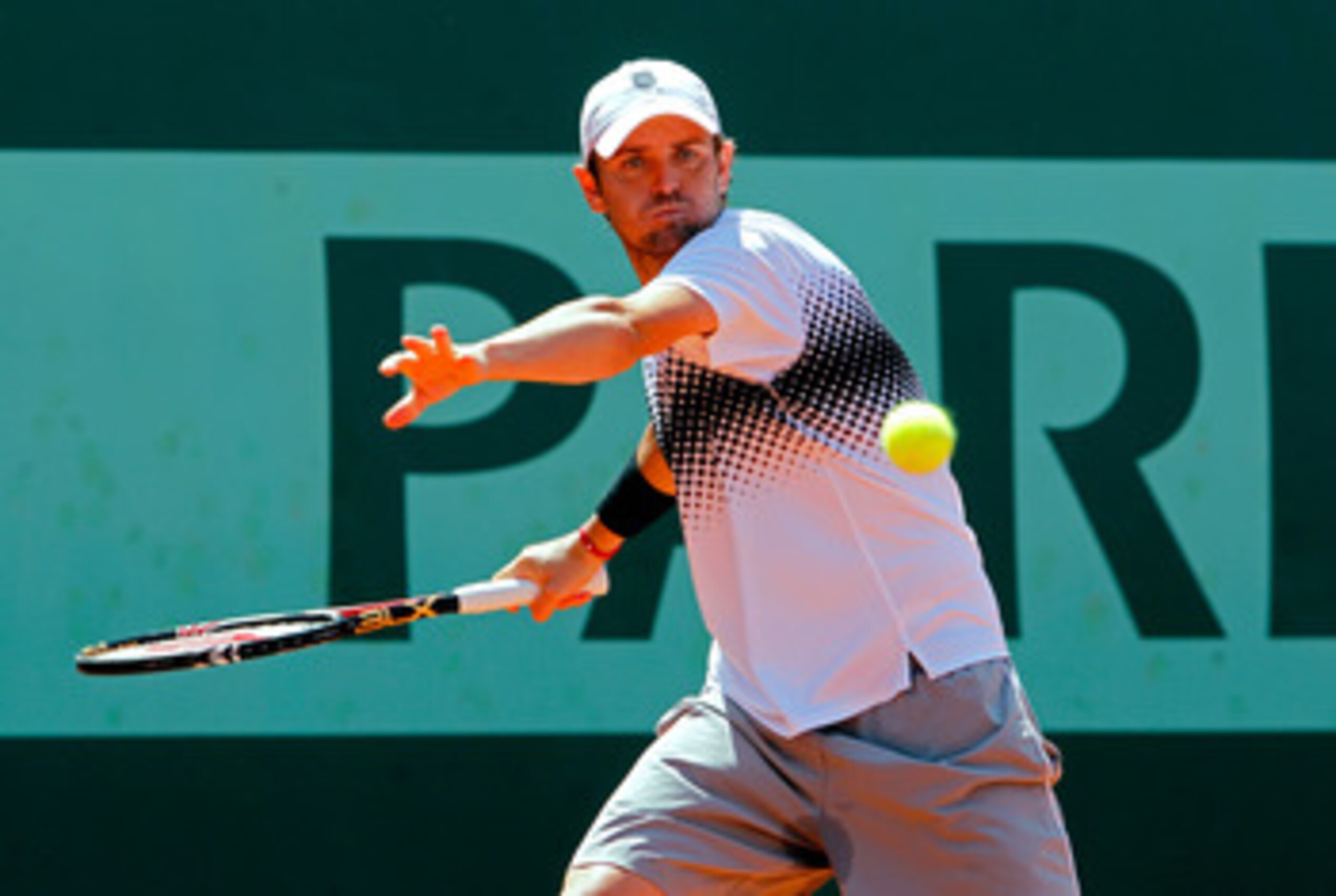 PARIS, FRANCE - MAY 23:  Mardy Fish of USA plays a forehand during the men's singles first round match between Mardy Fish of USA and Ricardo Mello of Brazil on day two of the French Open at Roland Garros on May 23, 2011 in Paris, France.  (Photo by Matthe