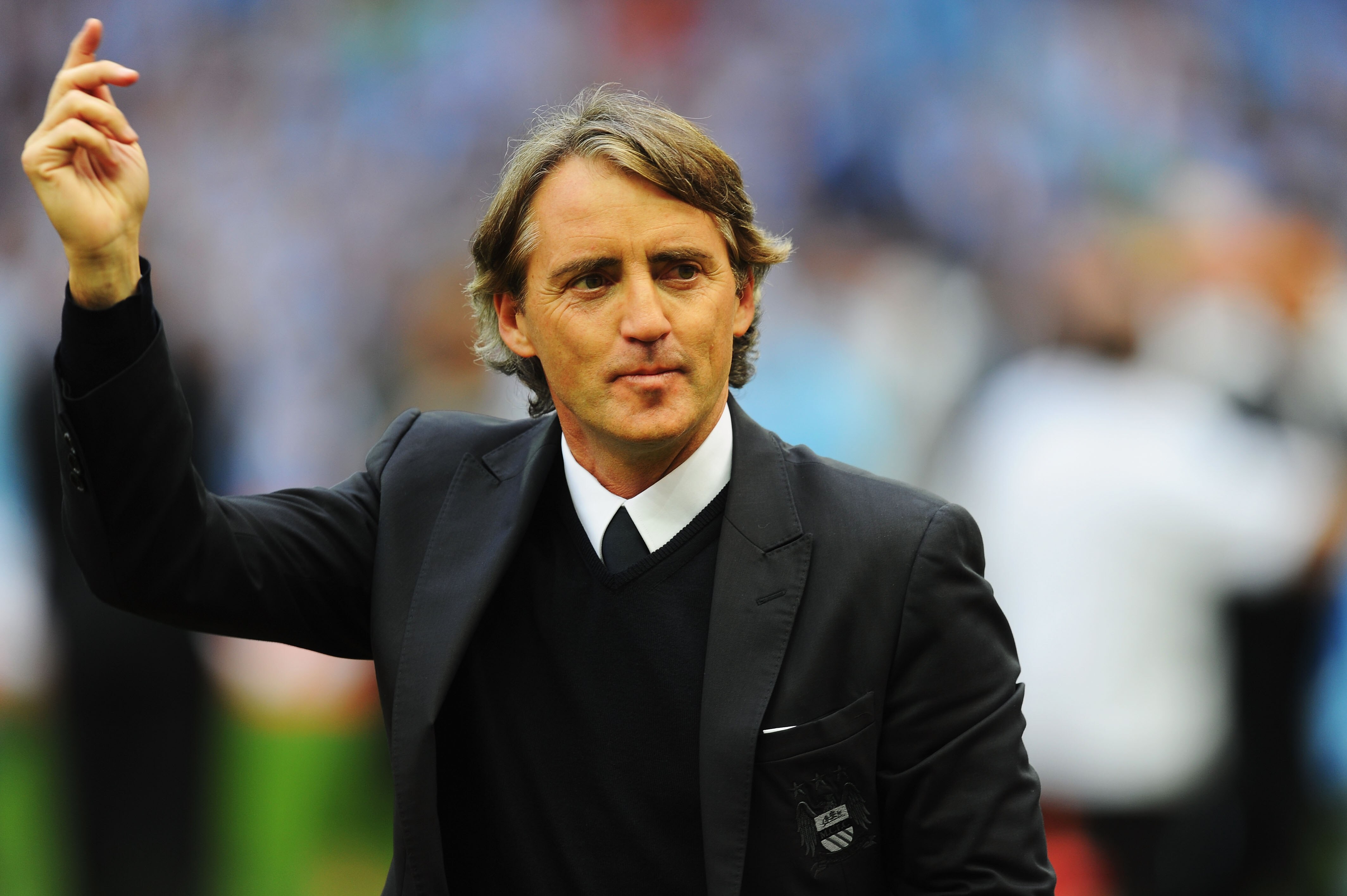 LONDON, ENGLAND - MAY 14:  Roberto Mancini reacts after his Manchester City team wins the FA Cup sponsored by E.ON Final match between Manchester City and Stoke City at Wembley Stadium on May 14, 2011 in London, England.  (Photo by Mike Hewitt/Getty Image