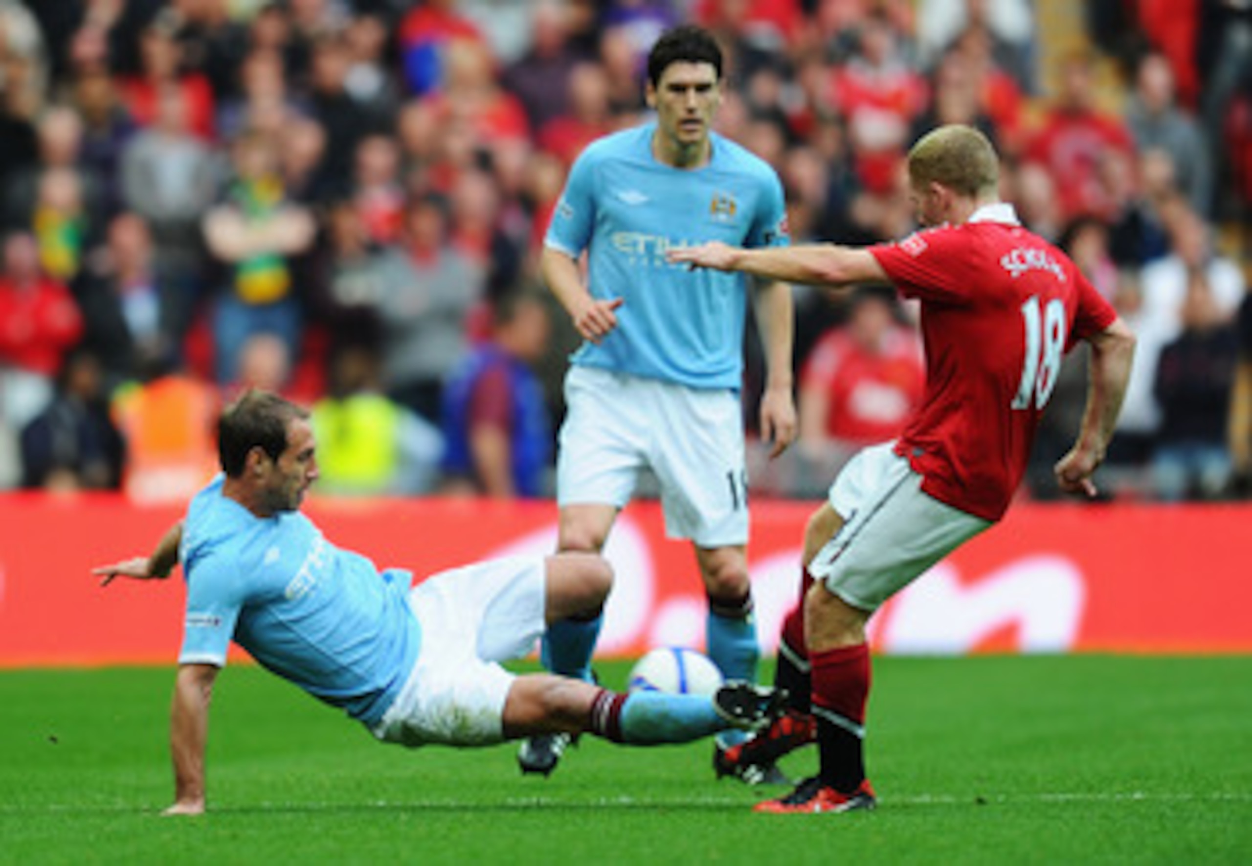 LONDON, ENGLAND - APRIL 16: Pablo Zabaleta of Manchester City tackles Paul Scholes of Man Utd during the FA Cup sponsored by E.ON semi final match between Manchester City and Manchester United at Wembley Stadium on April 16, 2011 in London, England.  (Pho