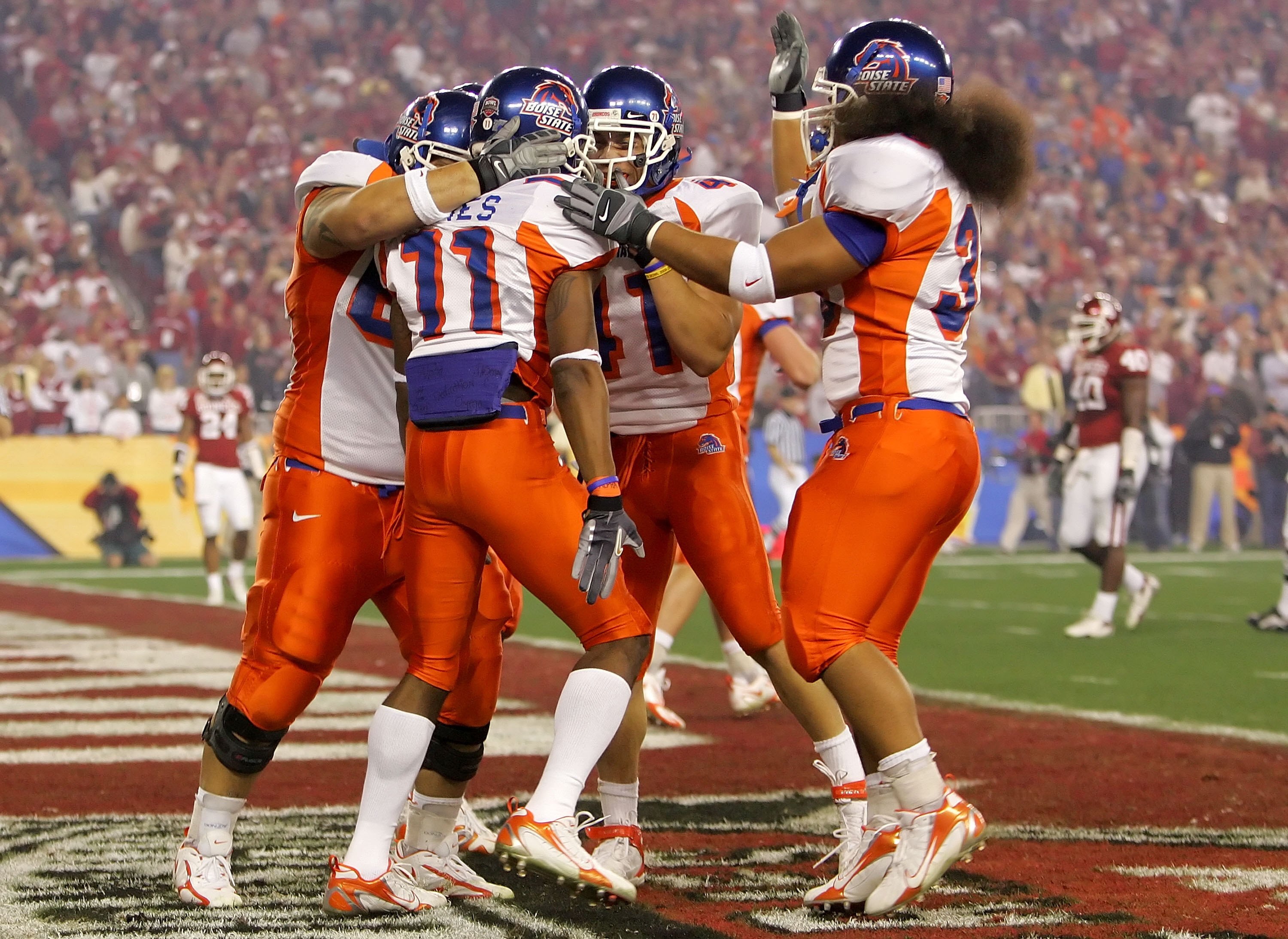 GLENDALE, AZ - JANUARY 01:  Wide receiver Drisan James #11 of the Boise State Broncos celebrates with teammates after scoring a 49-yard touchdown in the first quarter against the Oklahoma Sooners at the Tostito's Fiesta Bowl at University of Phoenix Stadi