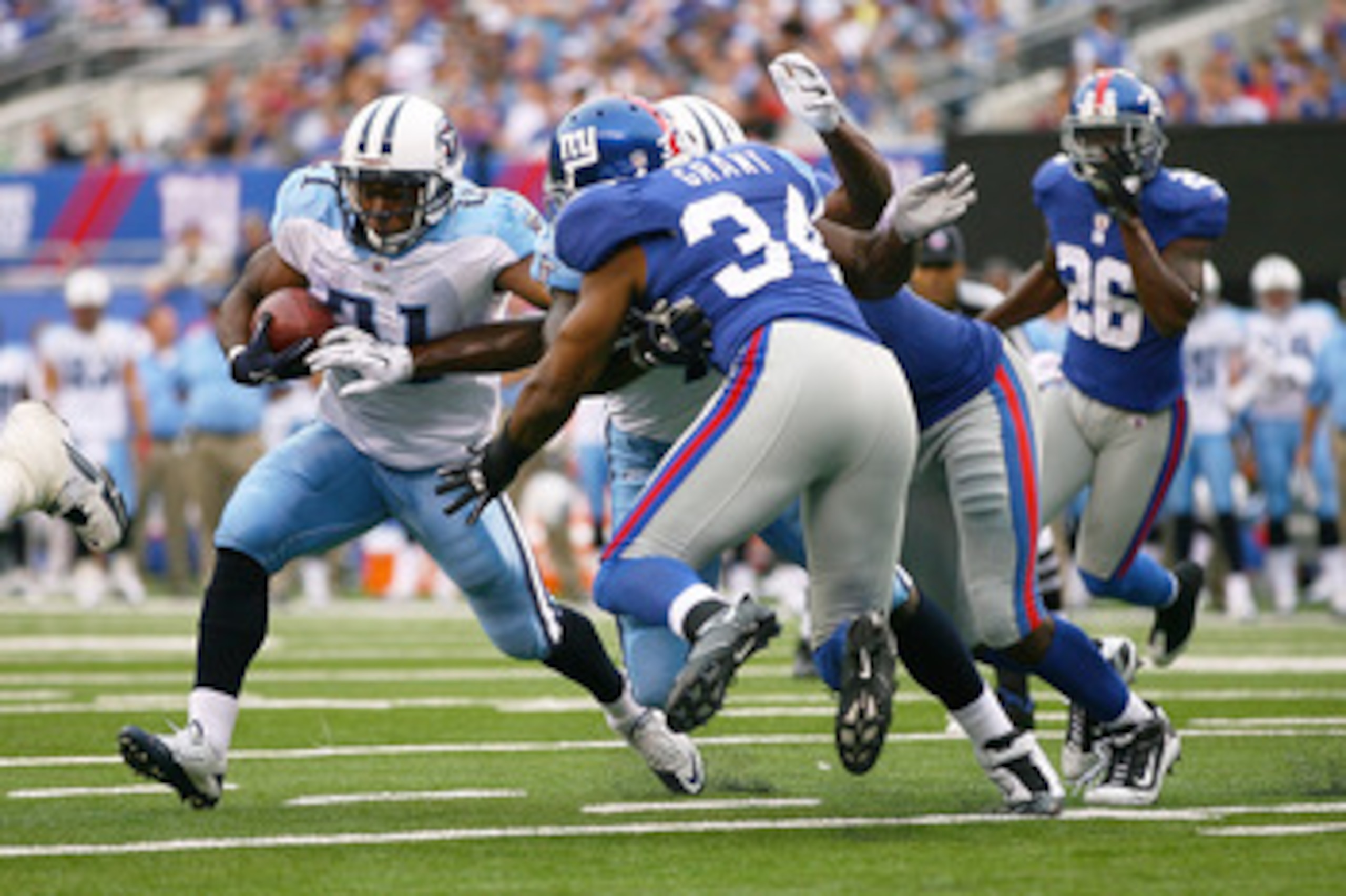 EAST RUTHERFORD, NJ - SEPTEMBER 26: Javon Ringer #21 of the Tennessee Titans runs the ball against the New York Giants at New Meadowlands Stadium on September 26, 2010 in East Rutherford, New Jersey.  The Titans defeated the Giants 29 - 10. (Photo by Andr